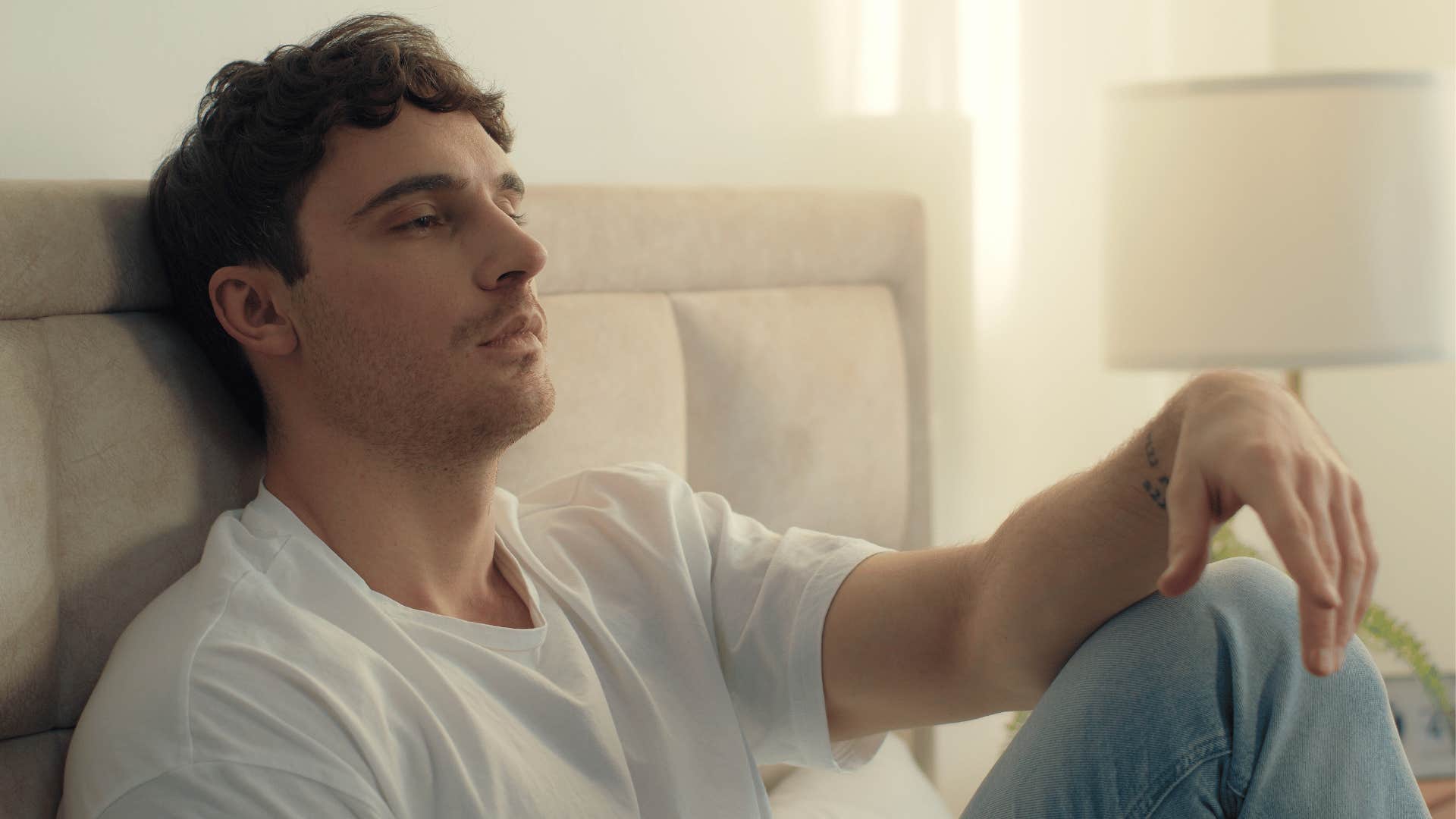 unhappy man grumbling in bed