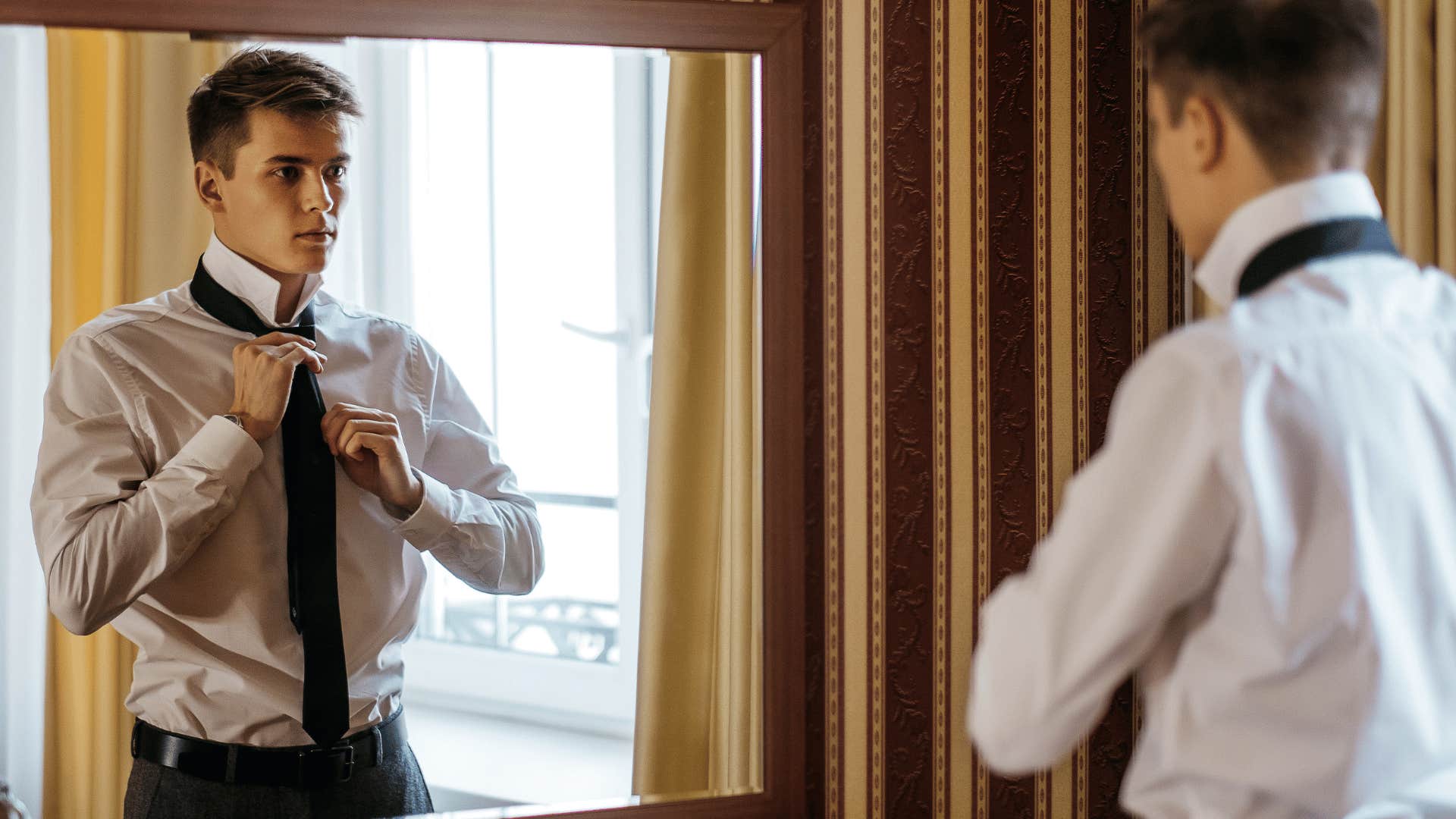 man rushing through getting ready for work in the morning