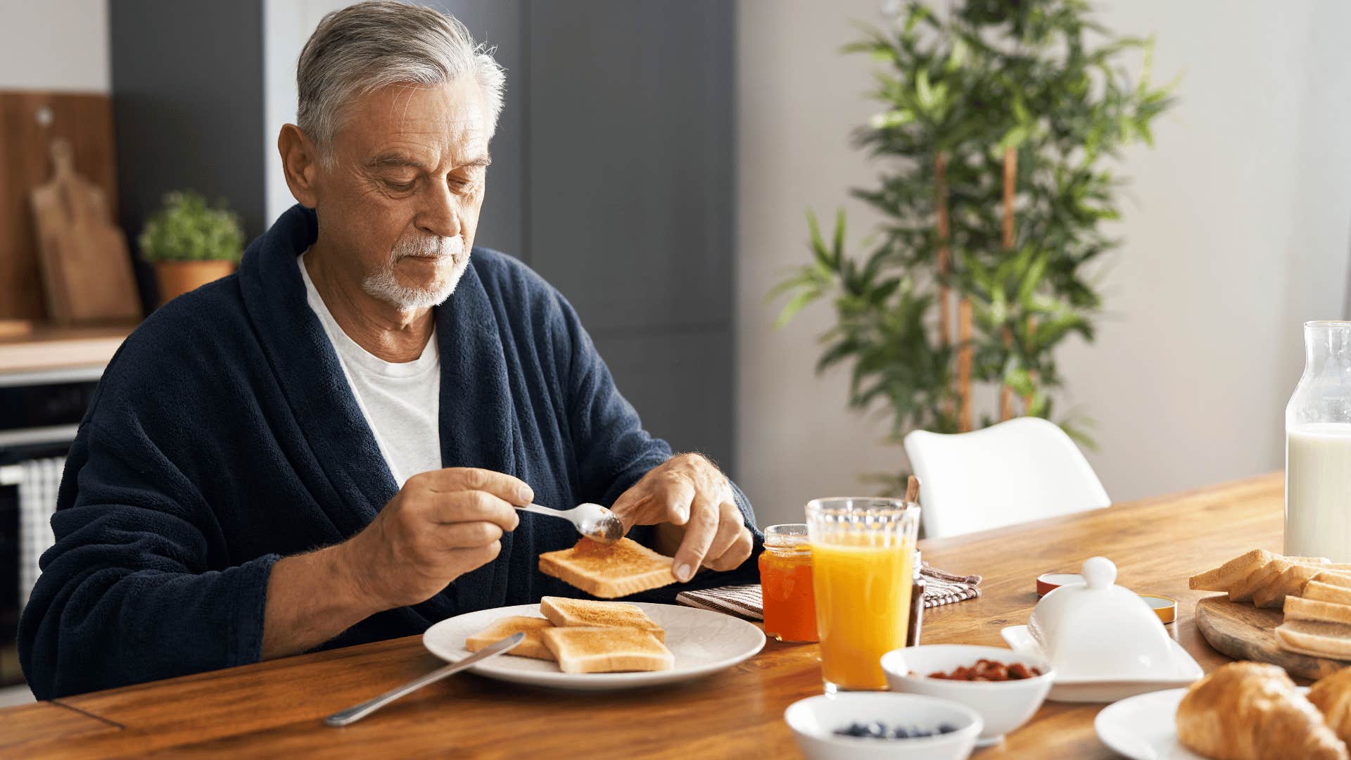 man eating breakfast without his wife