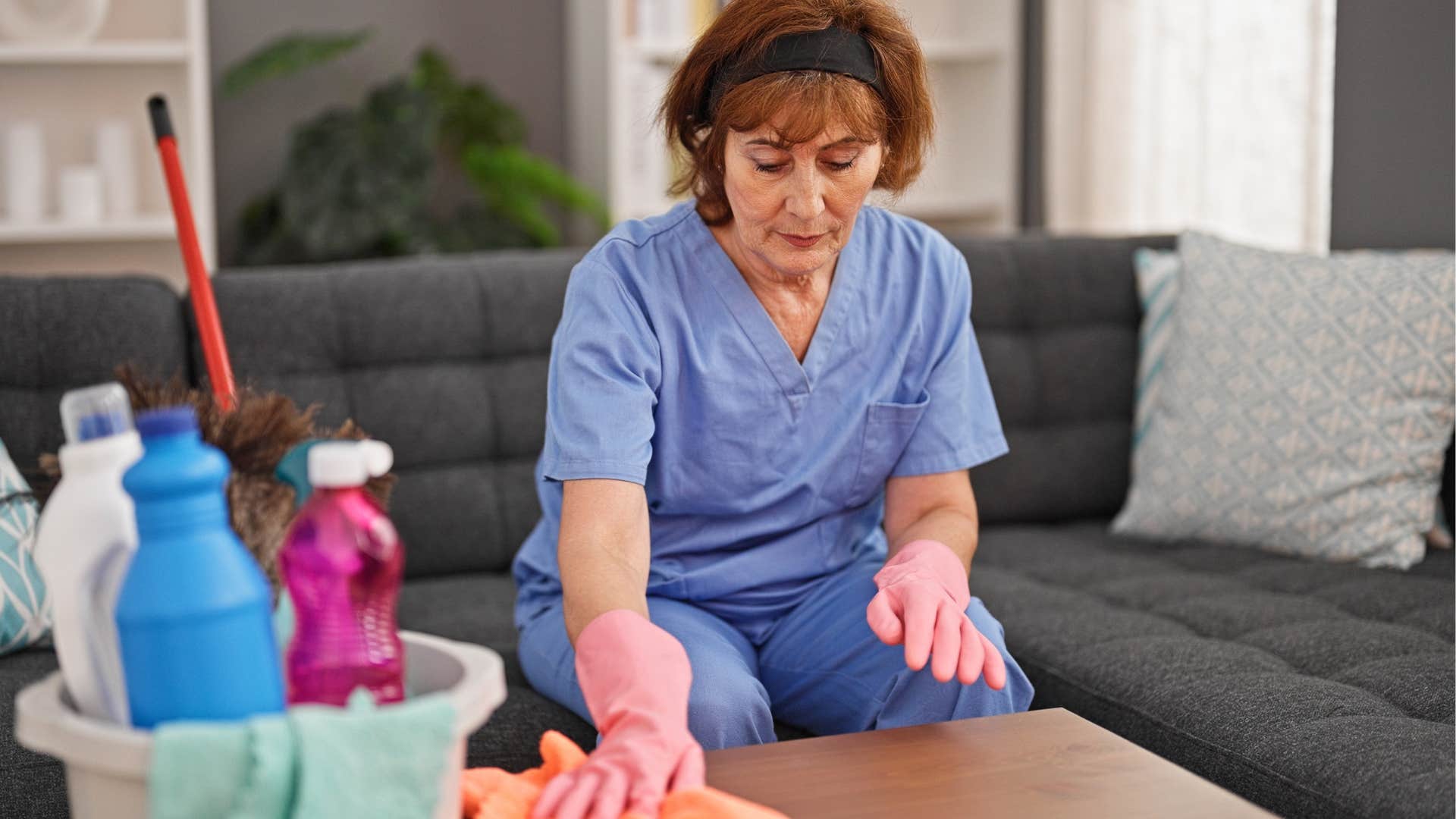 woman obsessively cleaning at home