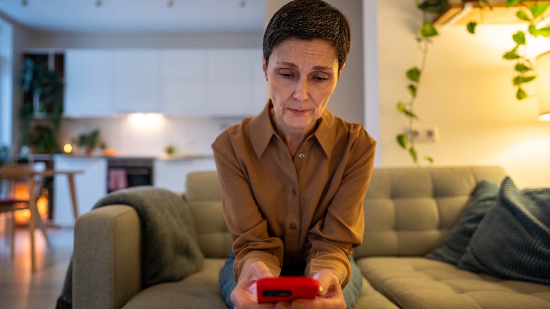 lonely older woman who spends more time on her phone