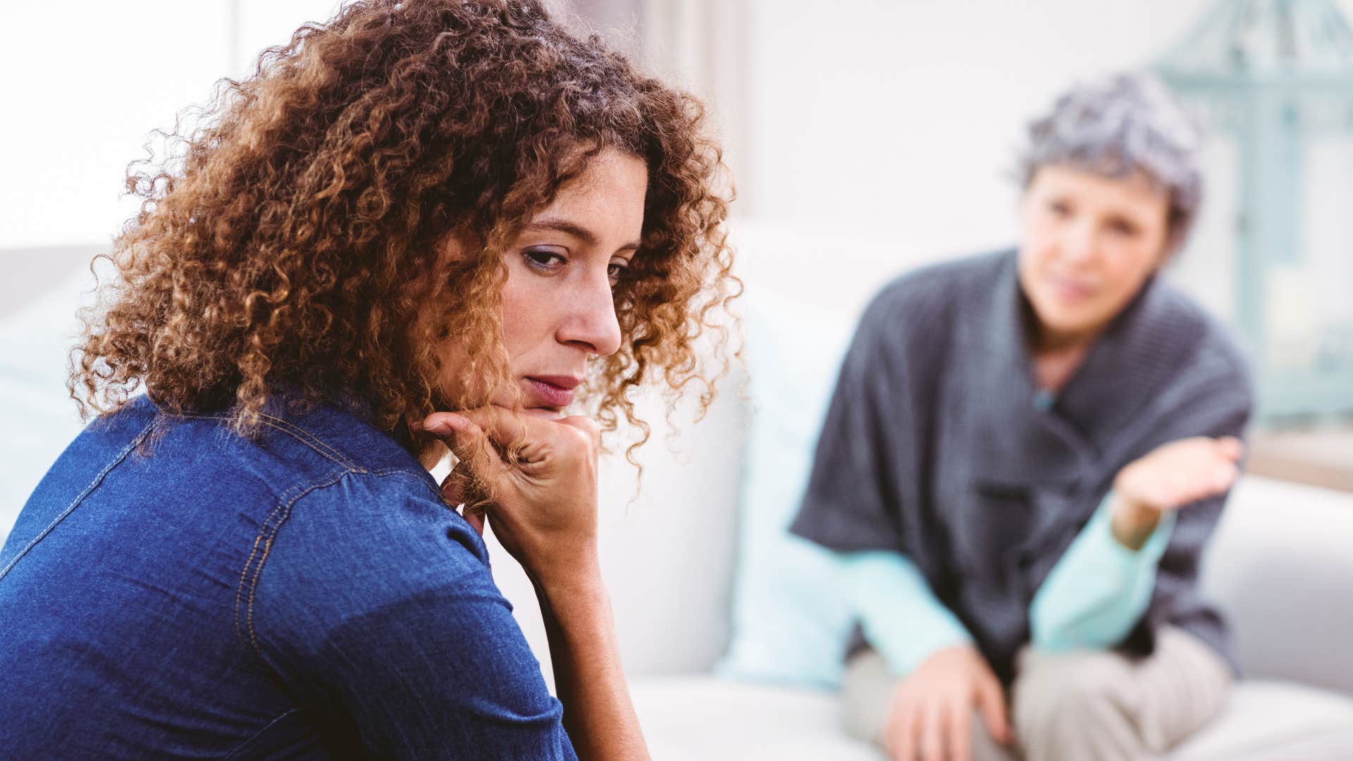 older mom stopping by unannounced sitting with daughter