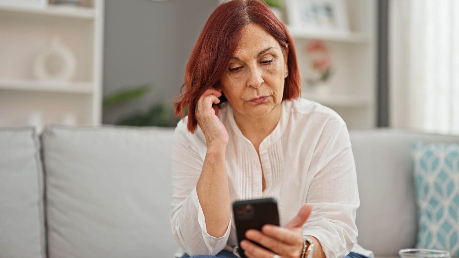 Woman saying "call me when you get a chance" on her phone.