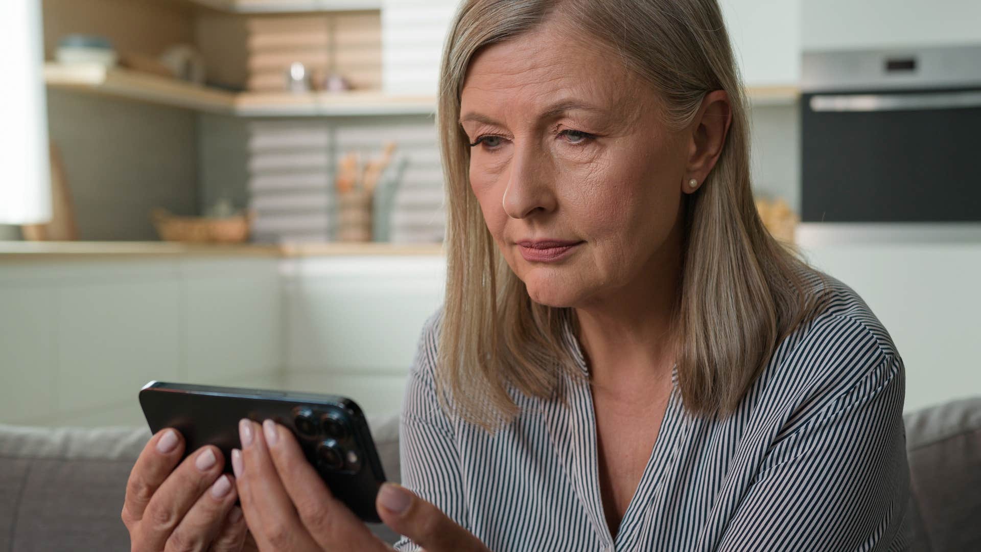 Woman saying "Do you need anything?" on her phone.