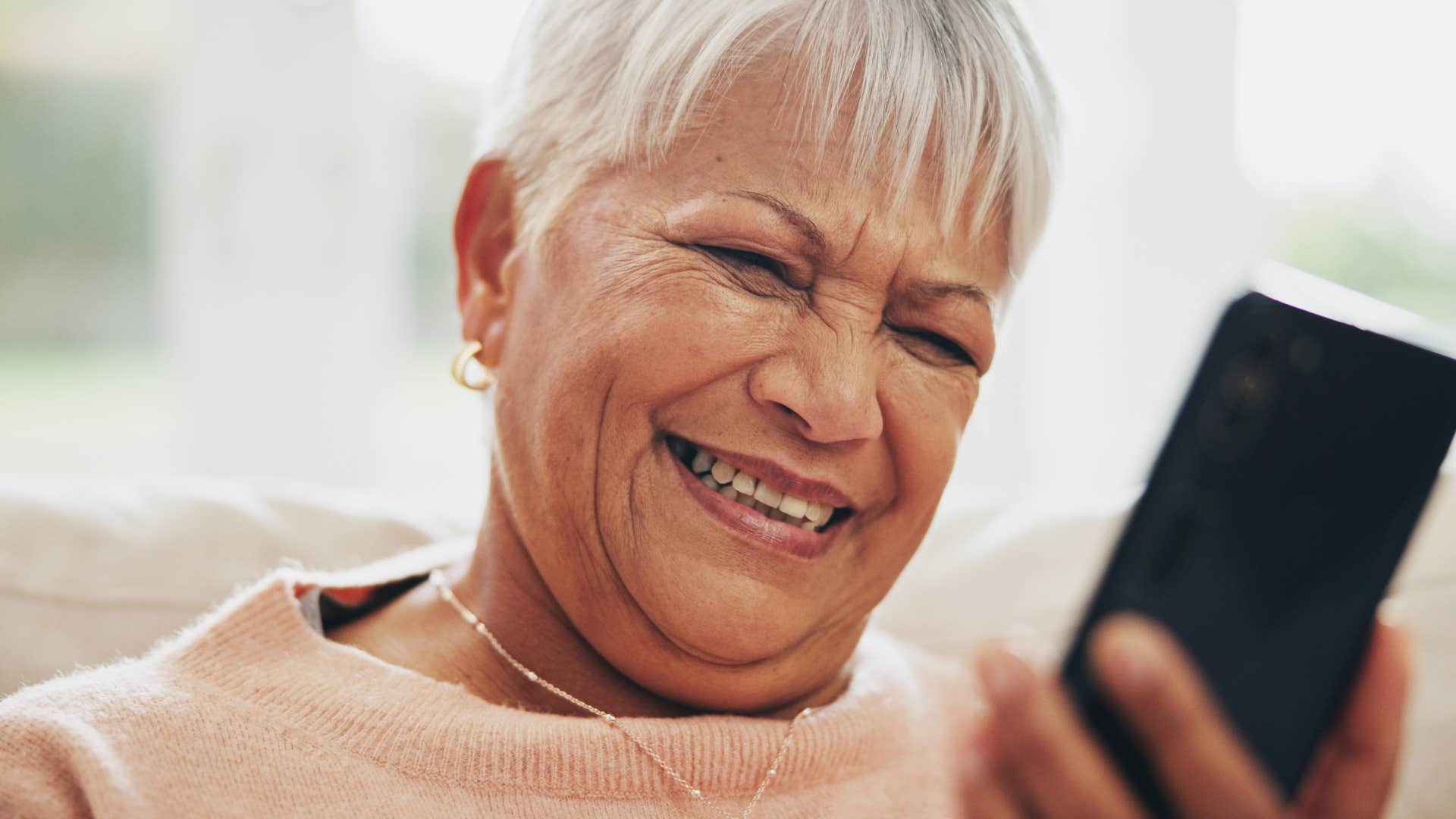 Woman saying "love you and miss you" on the phone.