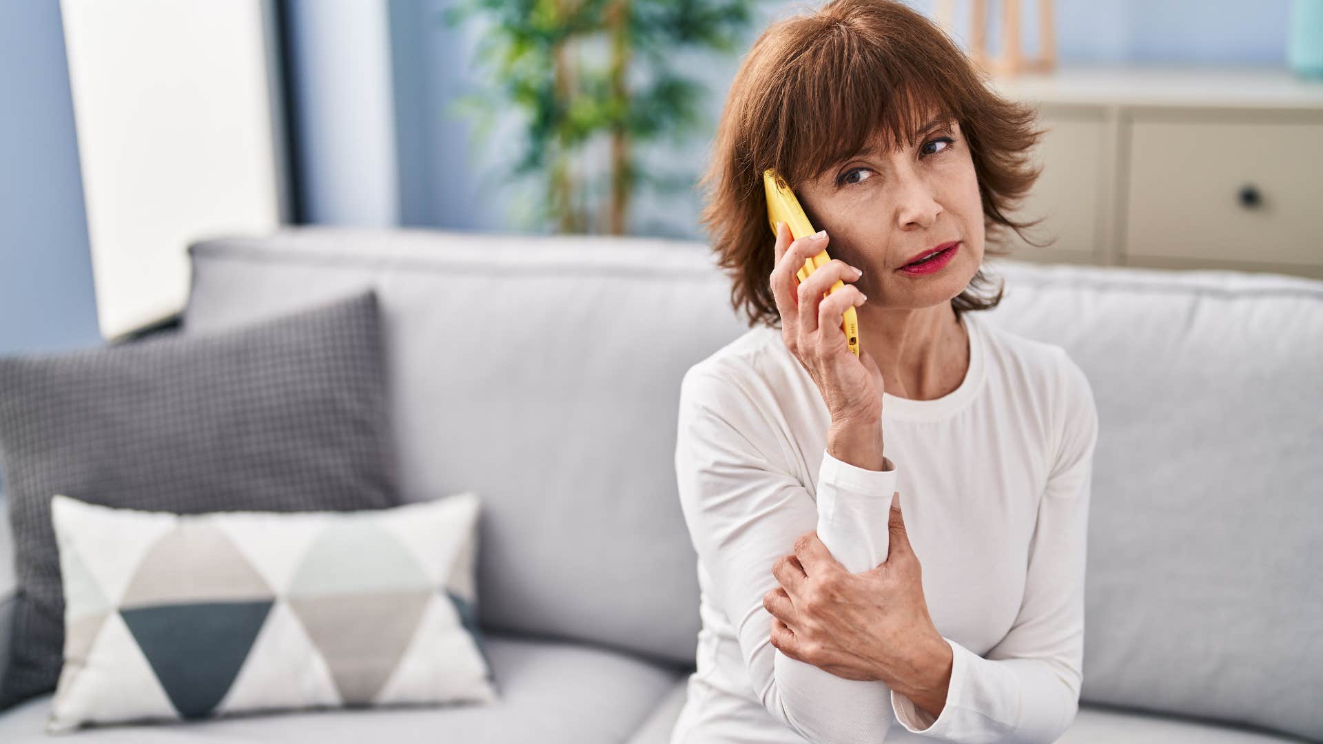 Woman saying "What are you up to today?" on her phone.