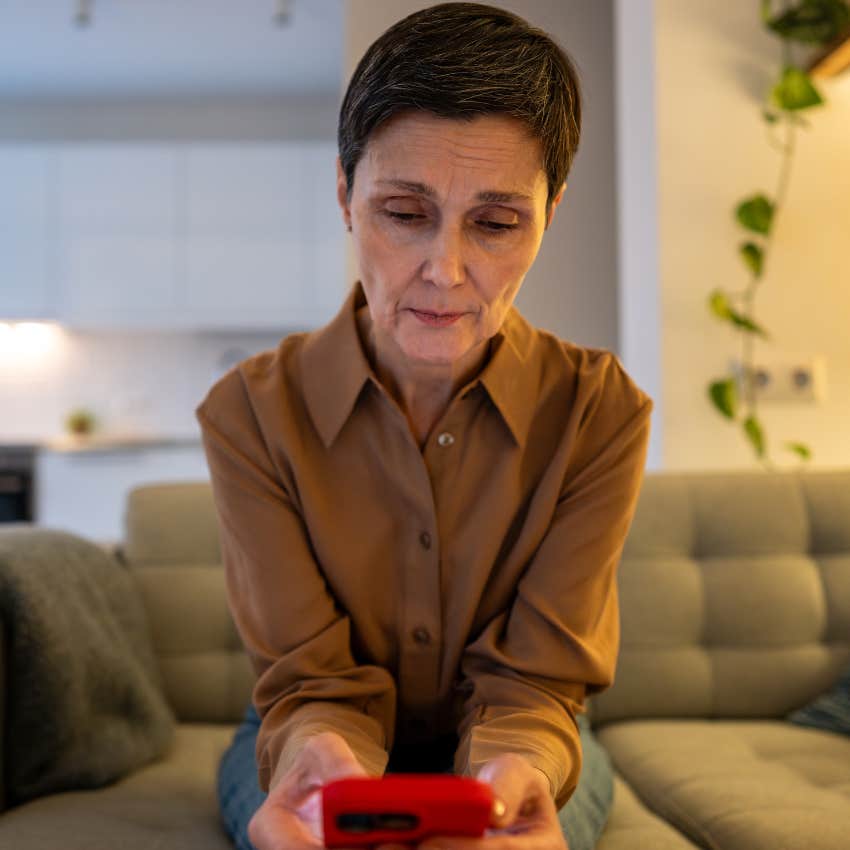 unhappy woman spending most of her time on her phone
