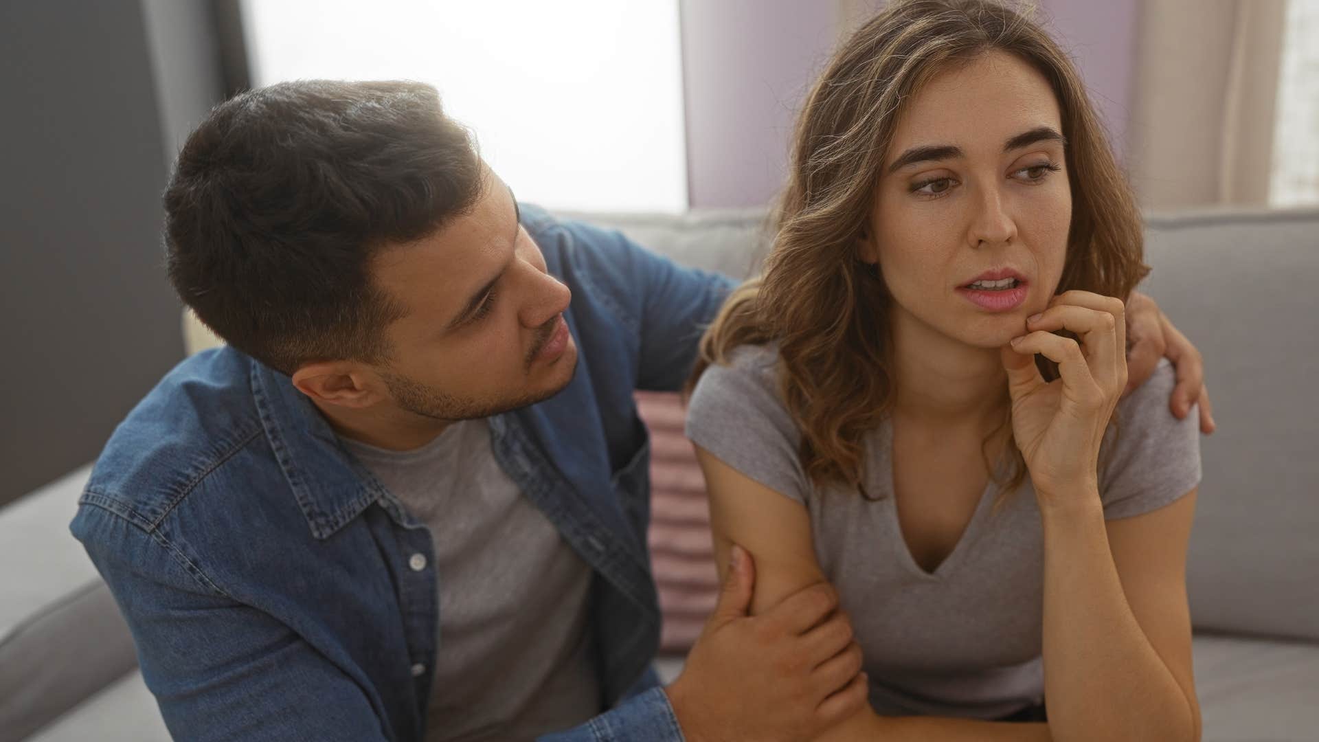 concerned husband comforting passive-aggressive wife who says don't overwork yourself
