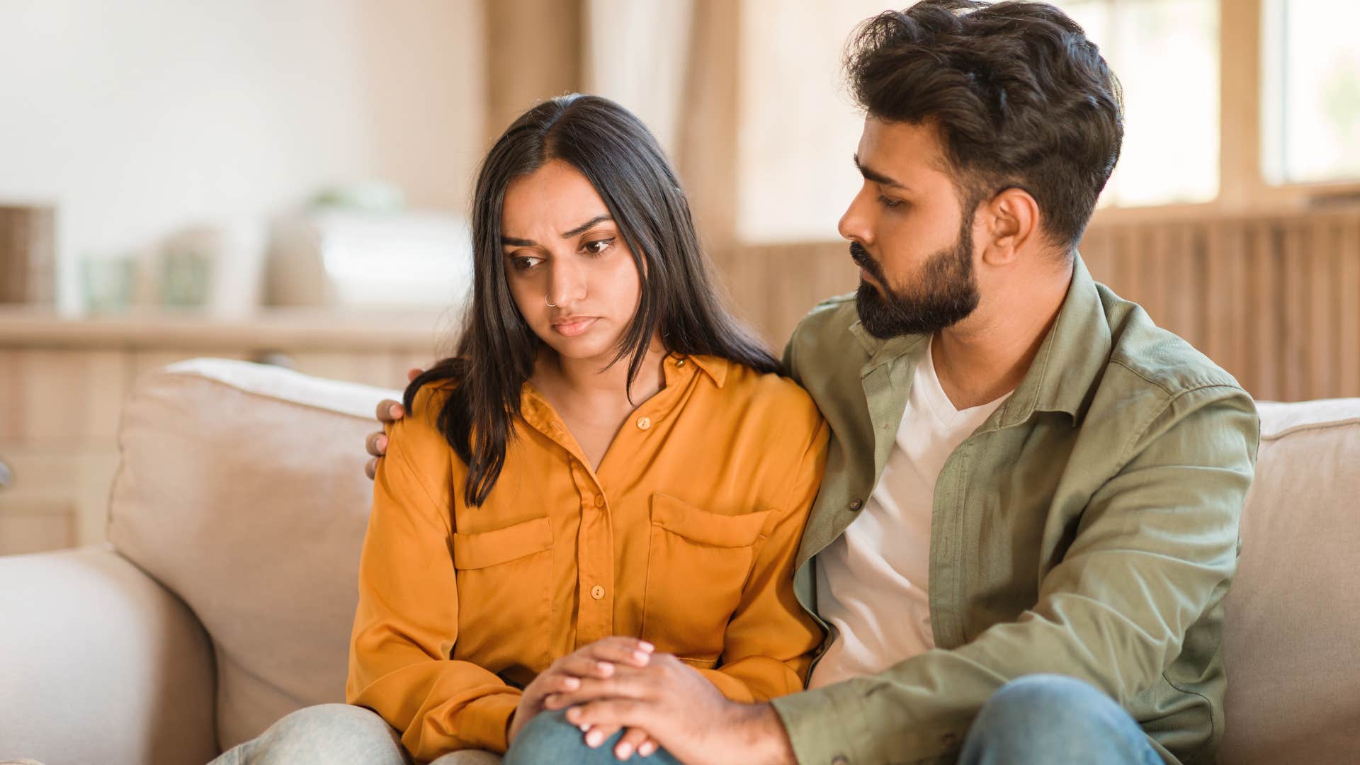 passive-aggressive upset woman saying I'm fine to concerned husband