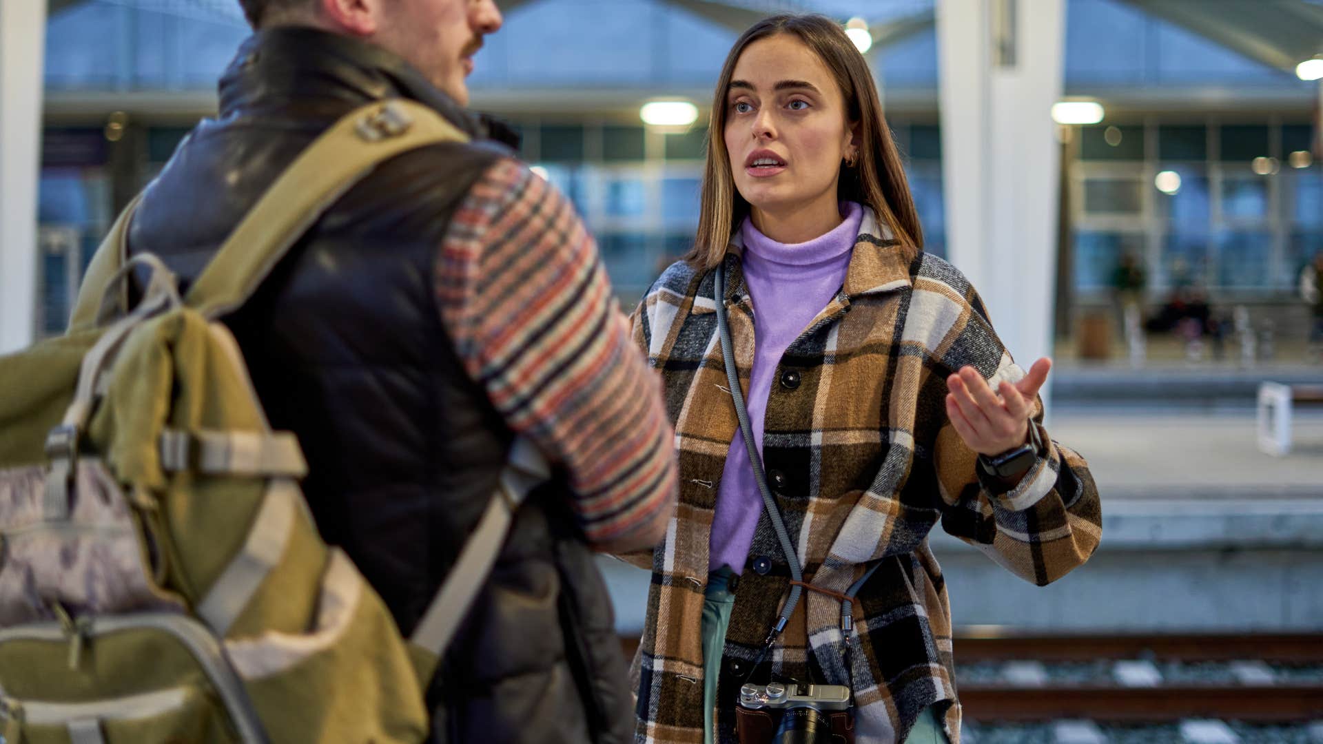 upset woman saying I'm sure you did to her husband in fight