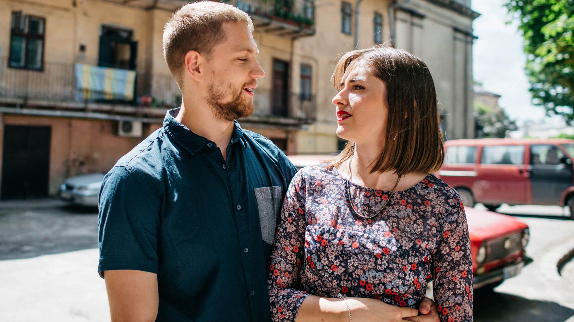 woman thanking husband standing out in public