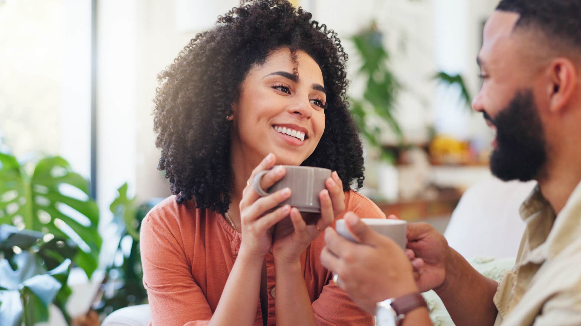 woman asking husband what he thinks over coffee