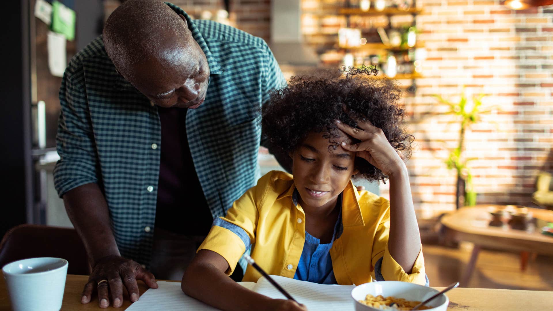 dad helping child with homework