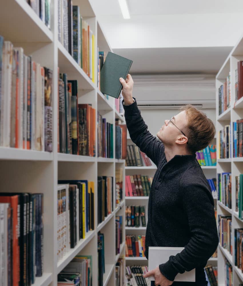 young man in library whose intelligence is not determined by his level of education