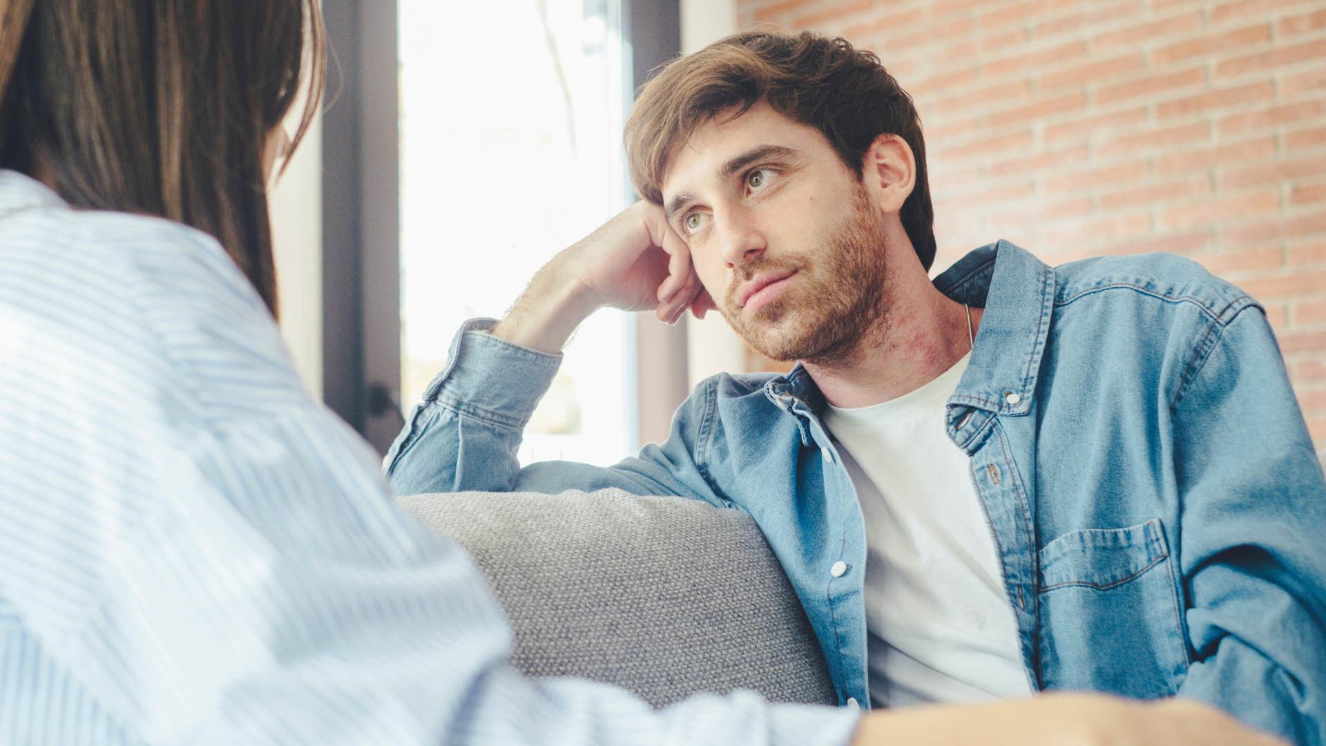 man avoiding seeking praise sitting at home