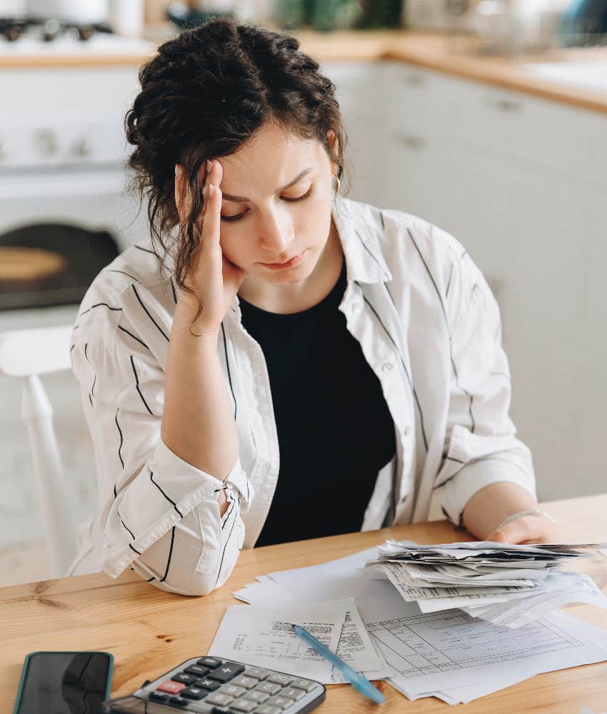 woman stressed over paying bills