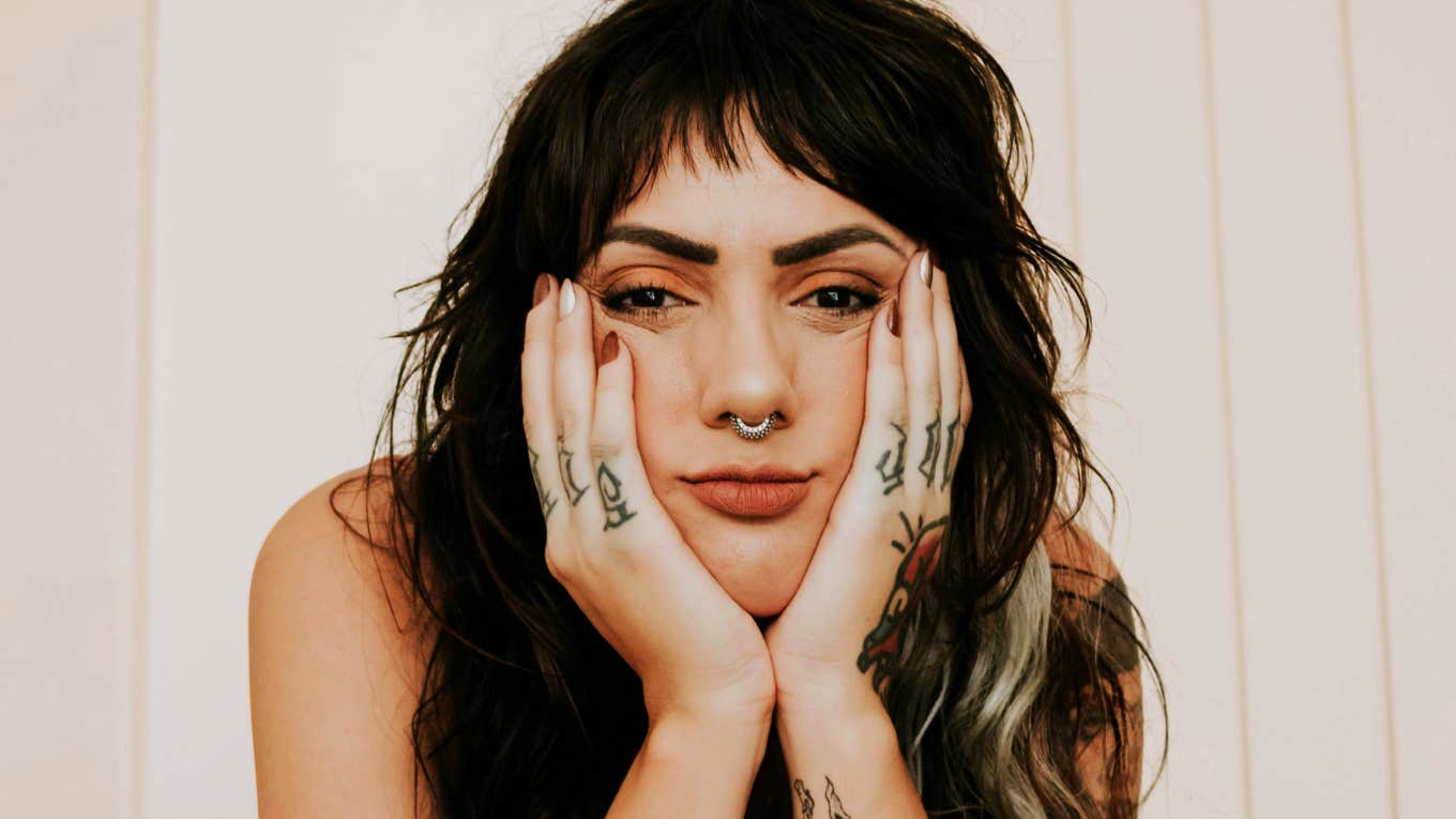 heartbroken person sitting alone, capturing the painful truths that surface when you love someone who refuses to commit