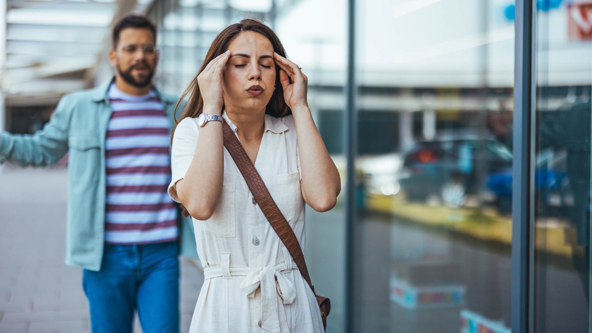 irritable woman walking away from husband