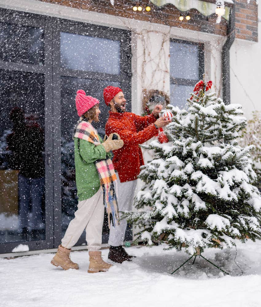 Couple decorating tree understand there are many reasons someone might not decorate for the holidays
