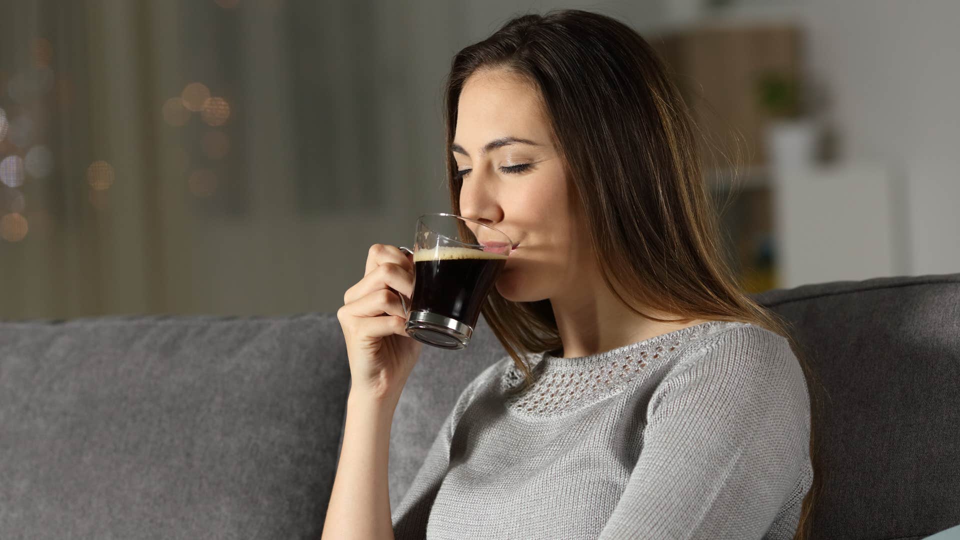 woman who is unhappy as she drinks too many fluids in the evening
