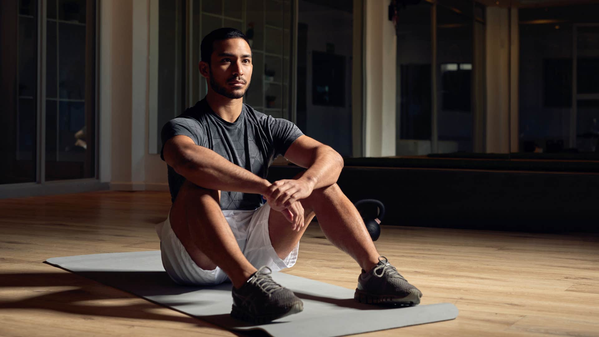 man who is unhappy as he exercises in the evening