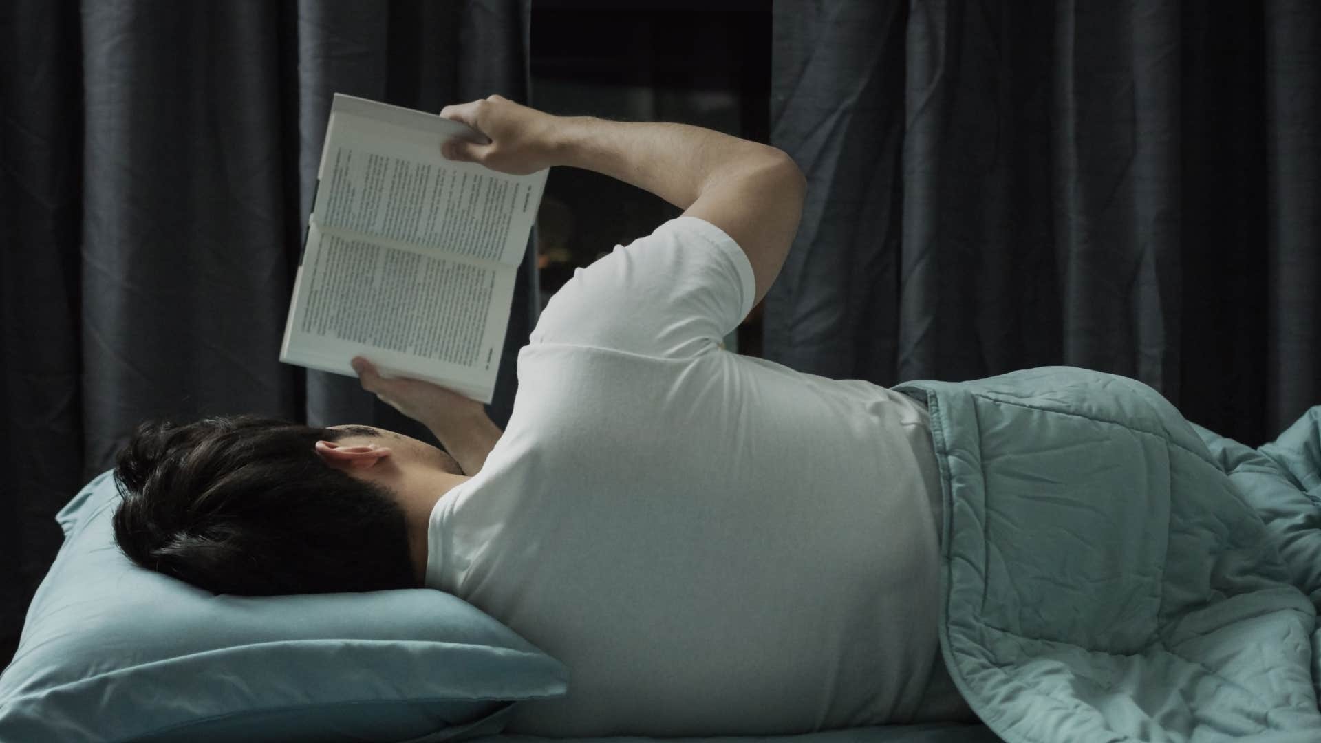 unhappy man with the evening habit of reading engrossing stories