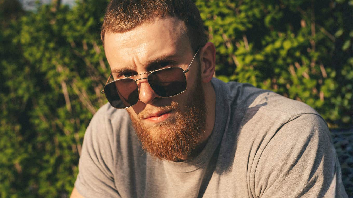 clingy man staring intensely with needy energy, capturing the early clingy behaviors men show when they treat someone like their emotional life raft