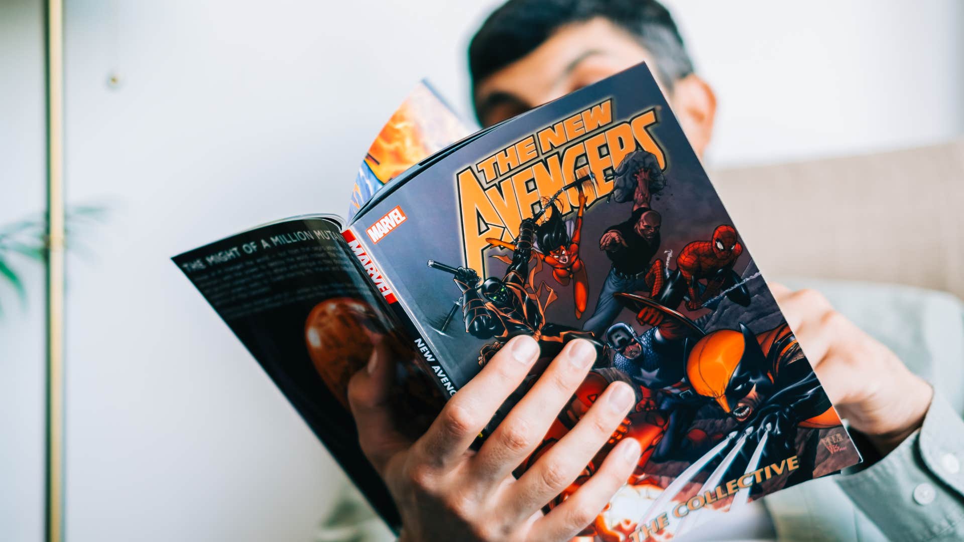 man reading comic books