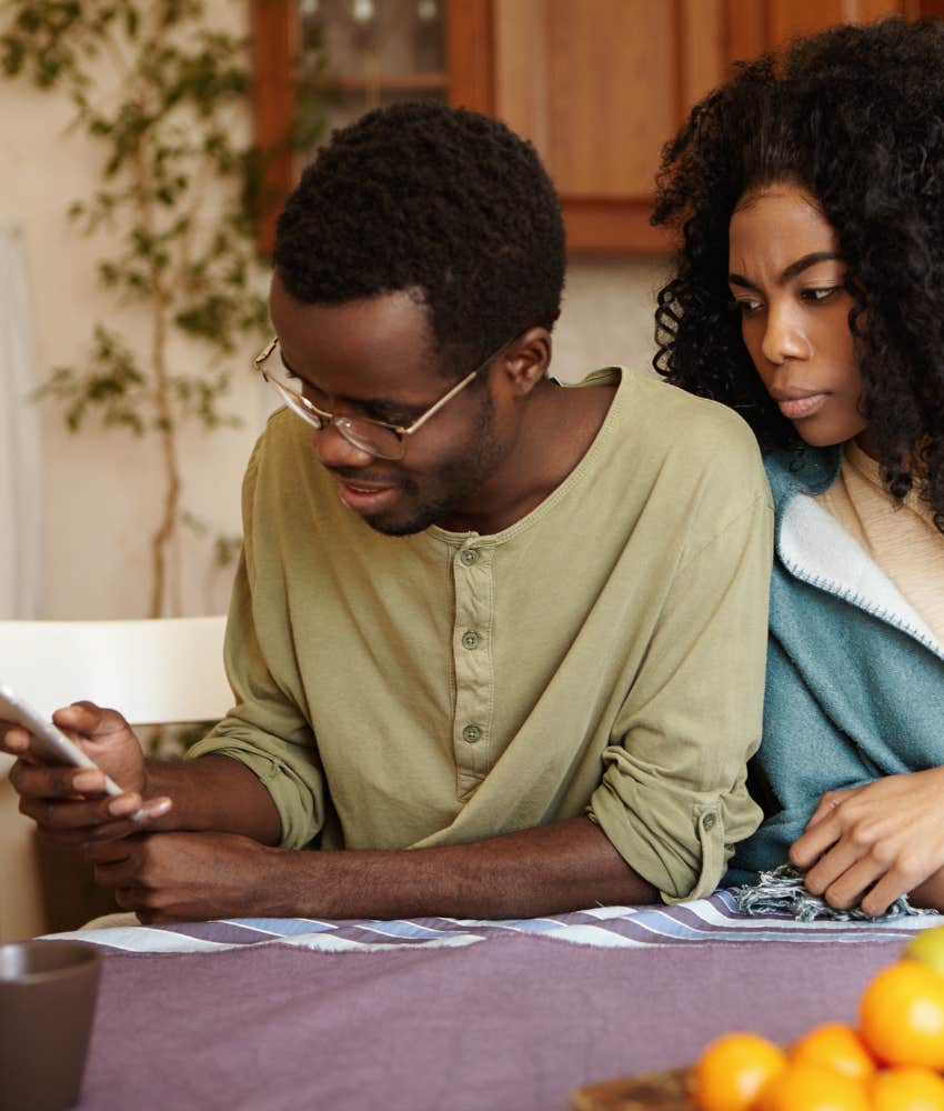 Flirty man on phone makes woman jealous showing clingy emotion