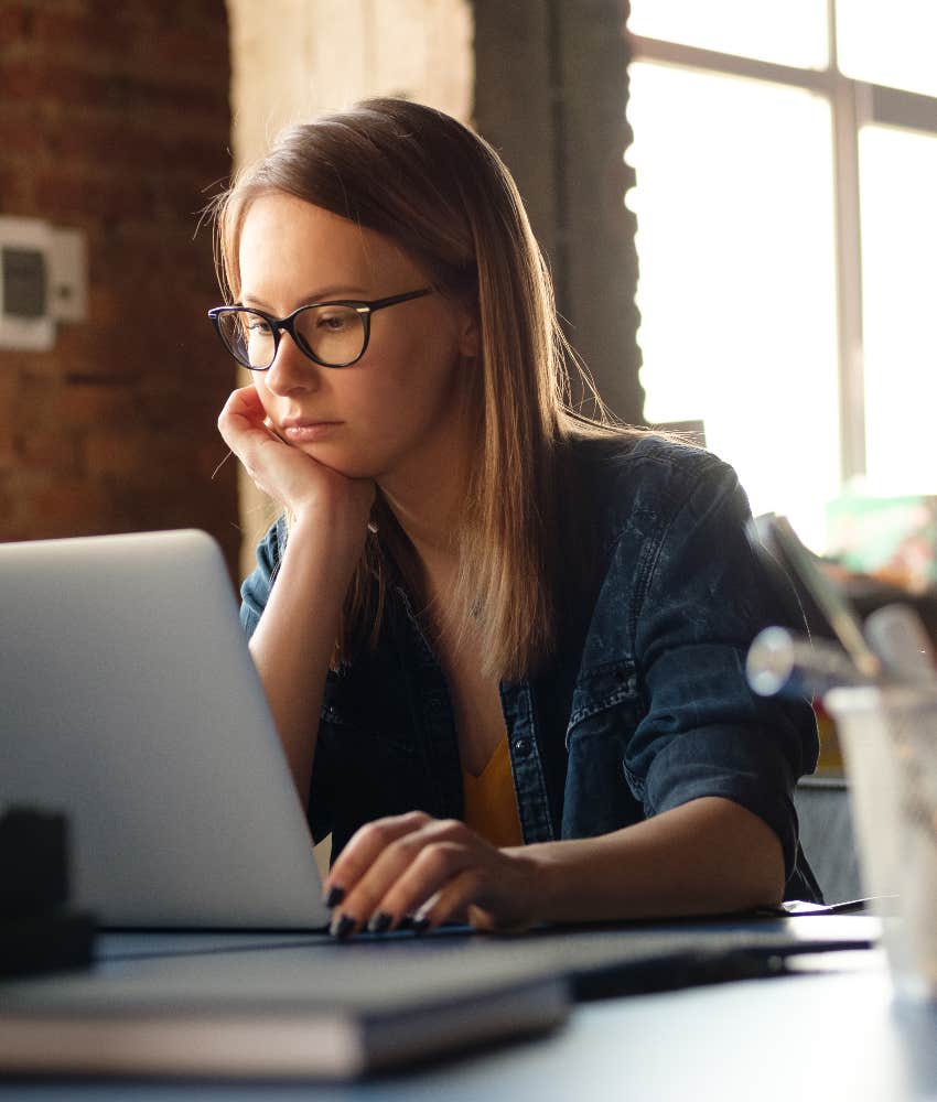 gen z woman working on laptop