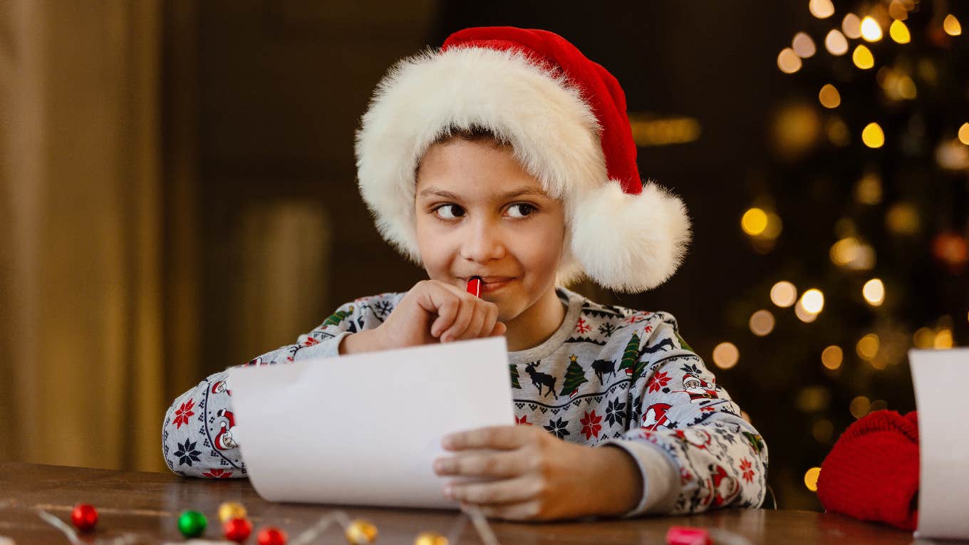 boy writing christmas list