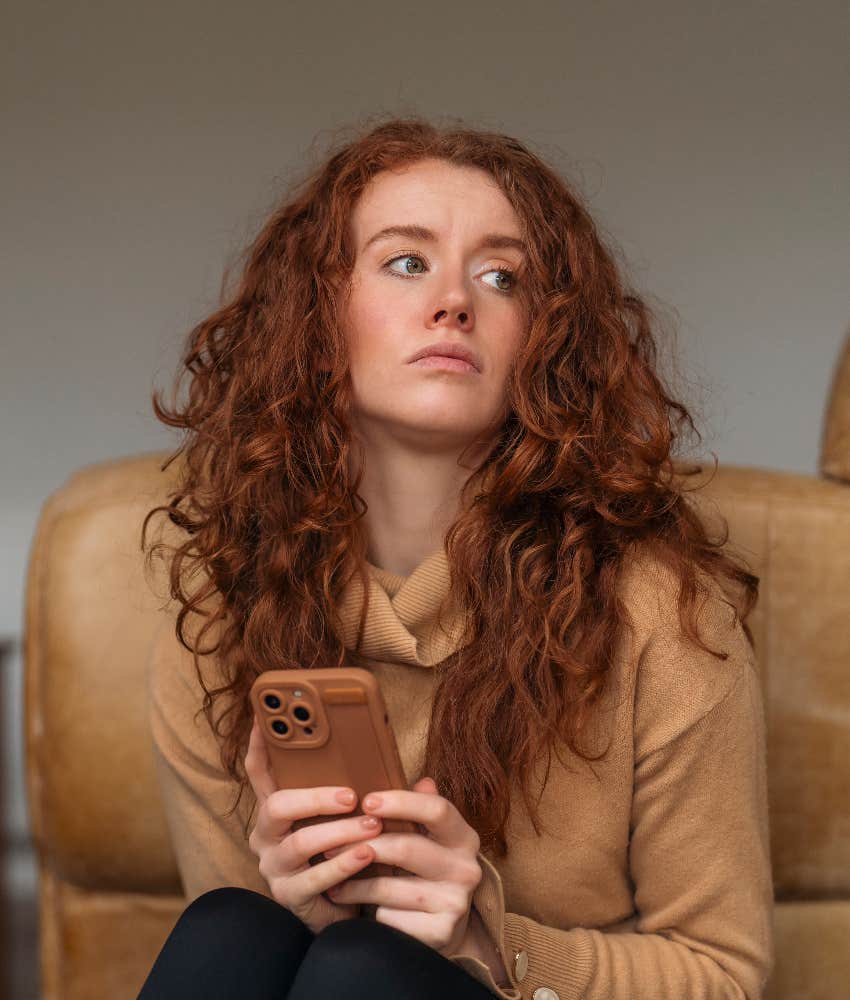 woman waiting for call on cell phone