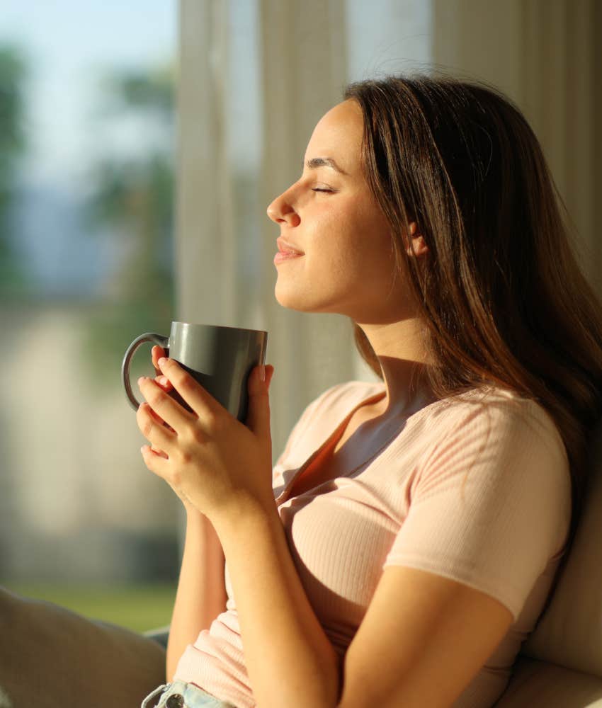 Woman keeping calm when things go wrong relaxing on her couch