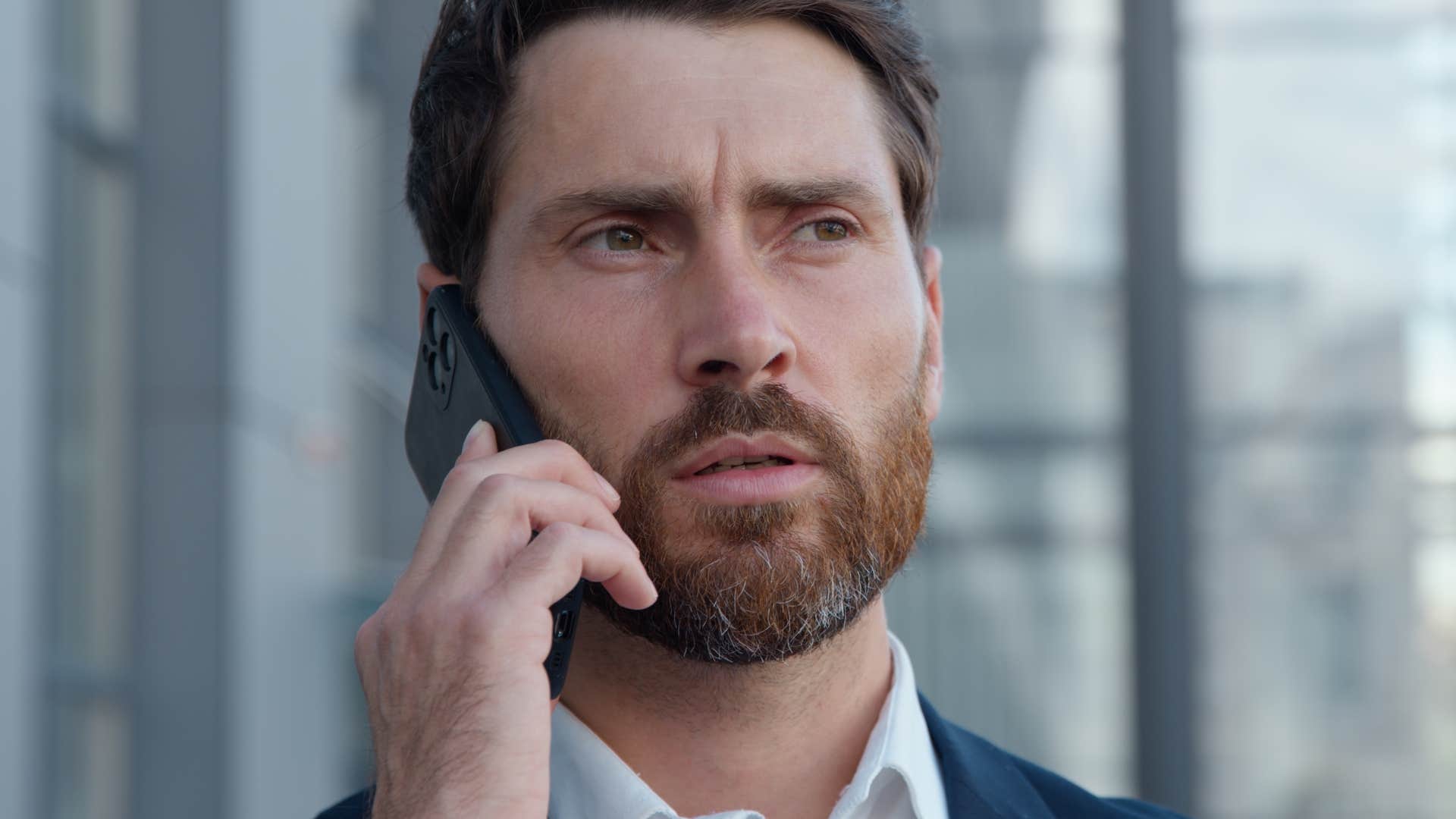 fake man whose values shift often talking on the phone