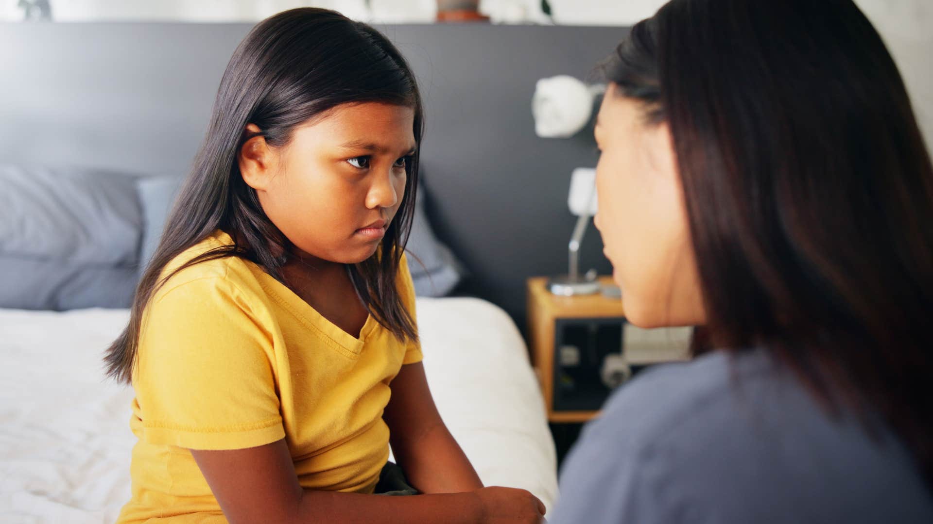 Little girl accepting "no" as a full answer from her mother.