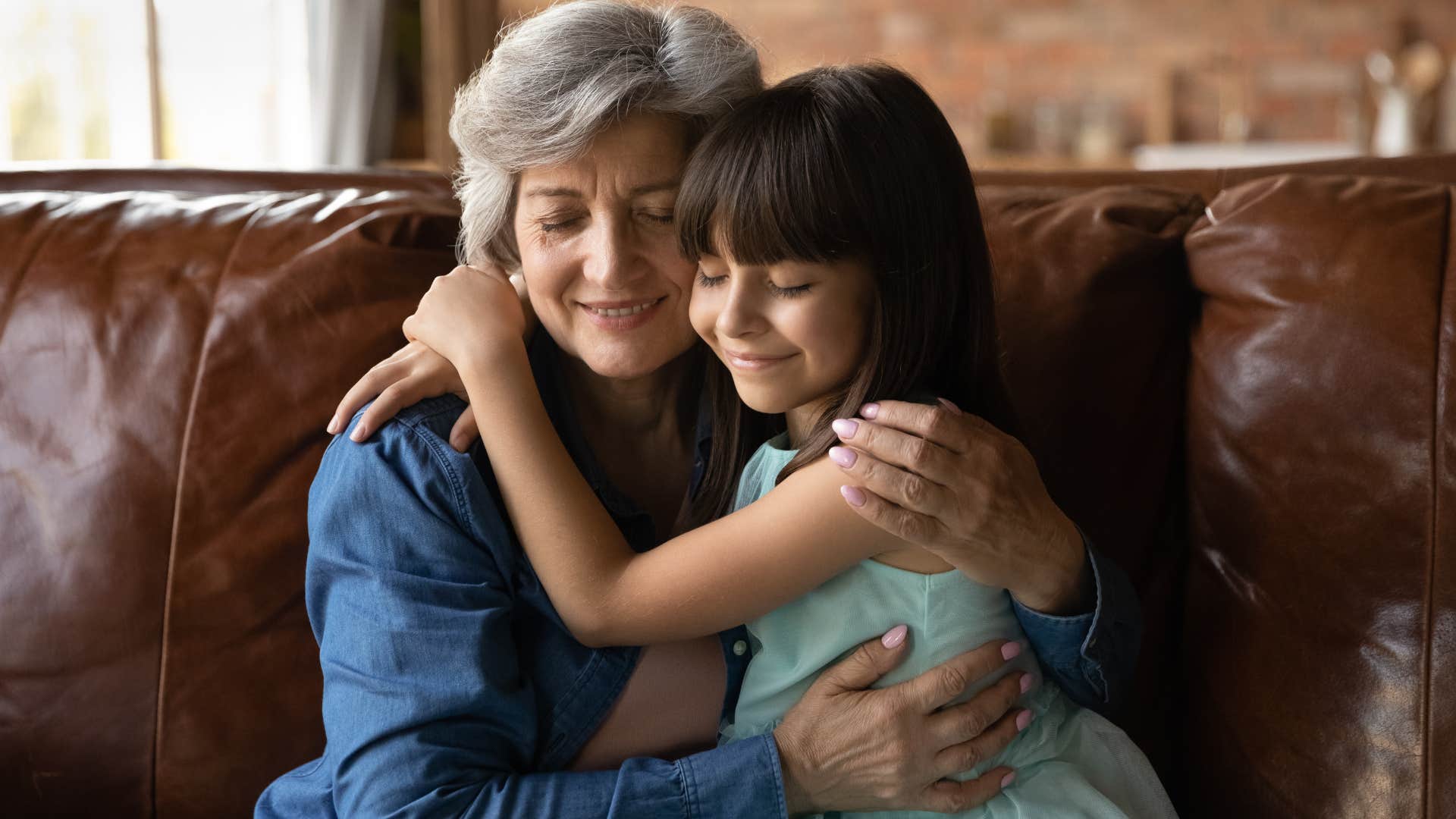 Woman hugging her grandchild and ushering us to introduce ourselves.