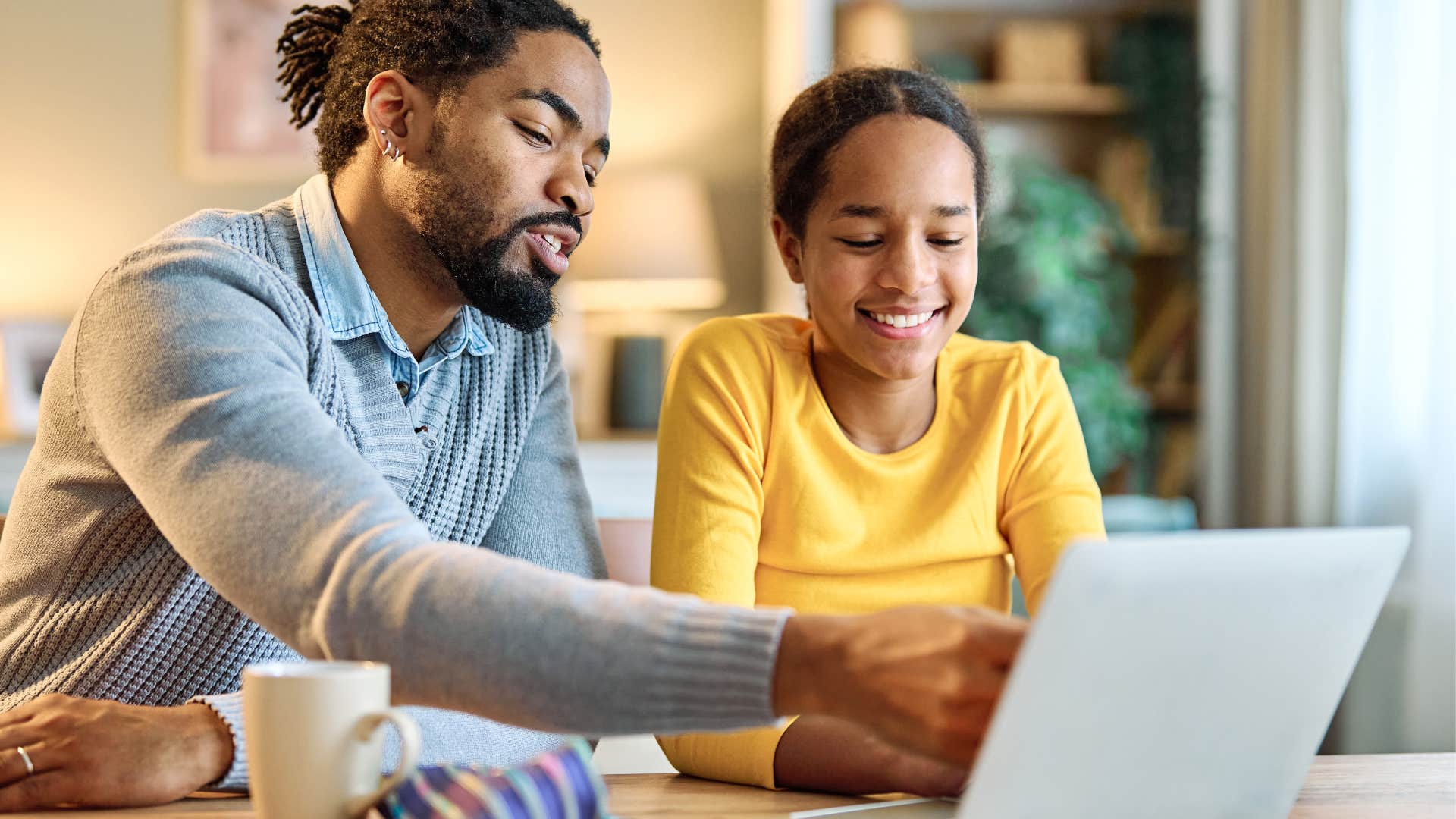 dad and daughter on the computer together