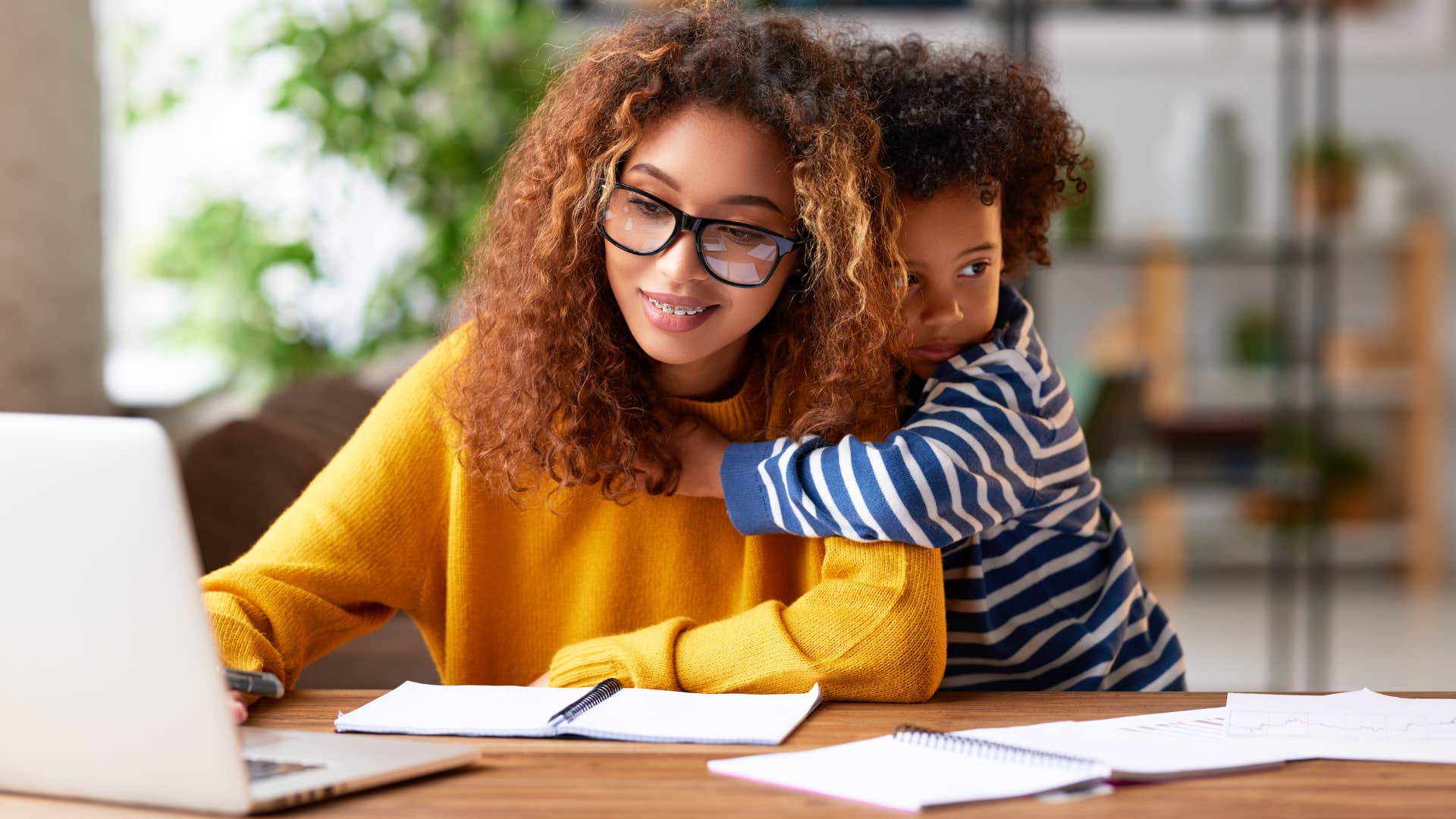 mom bragging about her child on the computer to feel validated