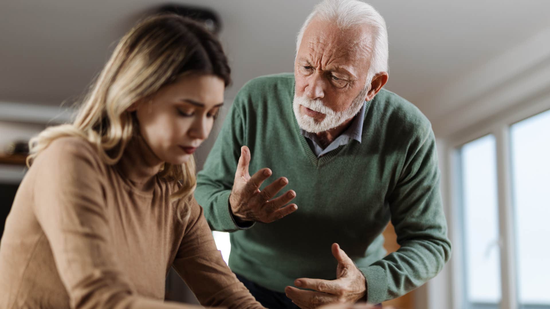 upset father telling sad adult daughter I guess I don't matter anymore