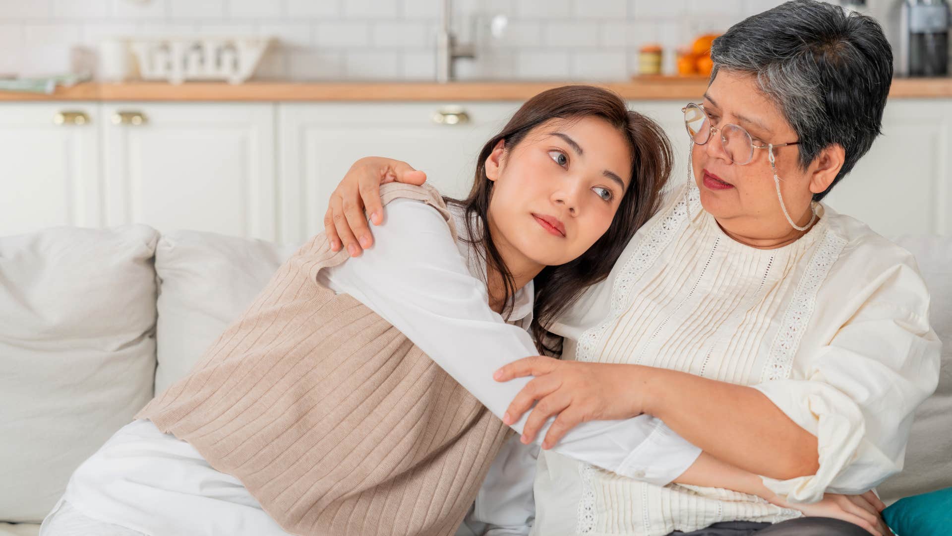 mom giving adult daughter advice hugging