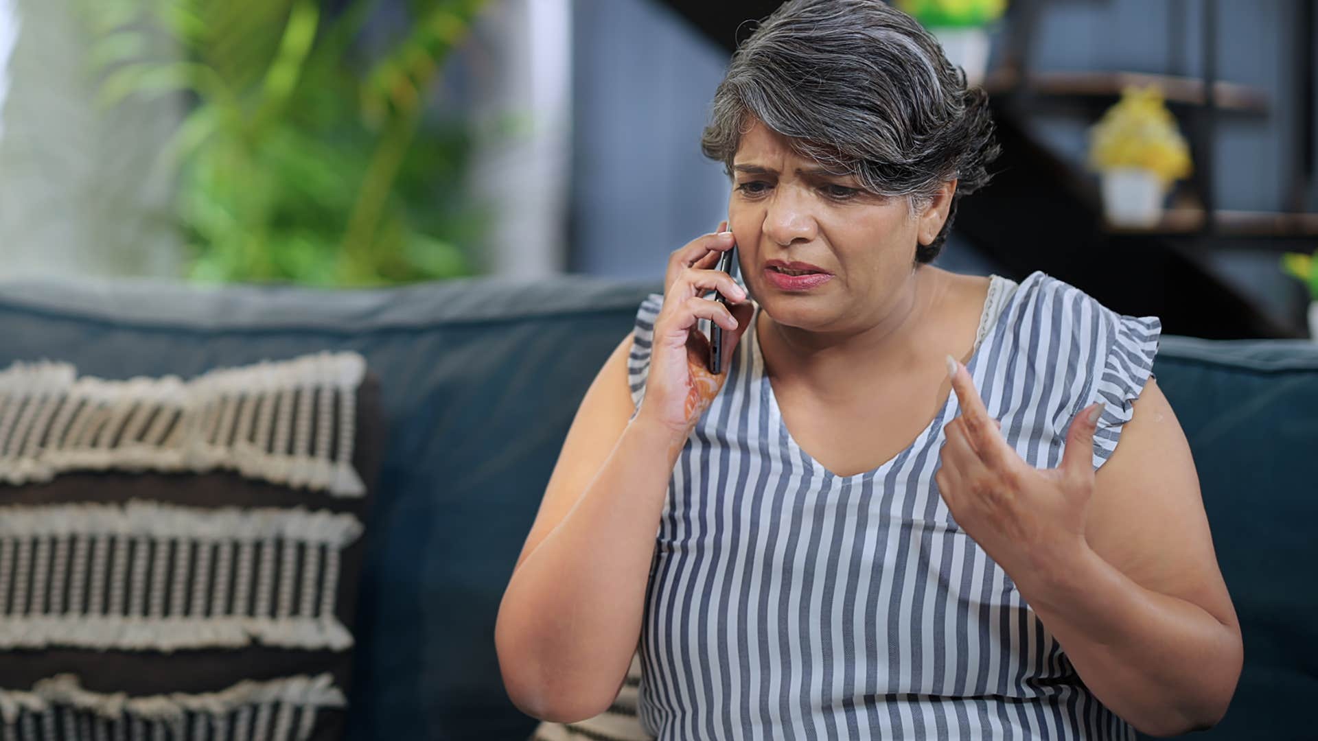 hurt mother on the phone telling adult kids you never visit anymore