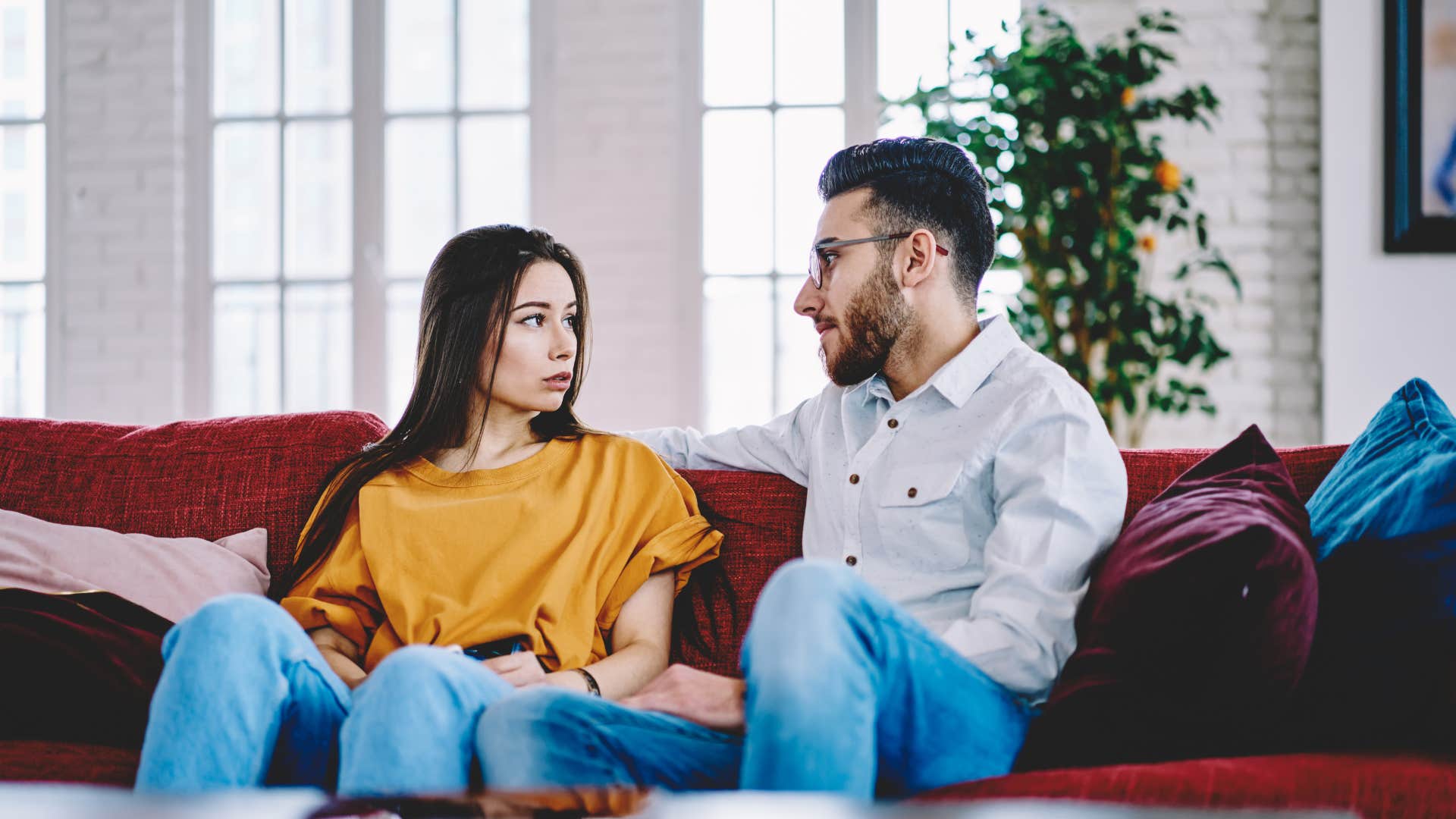 woman fidgeting while talking with man