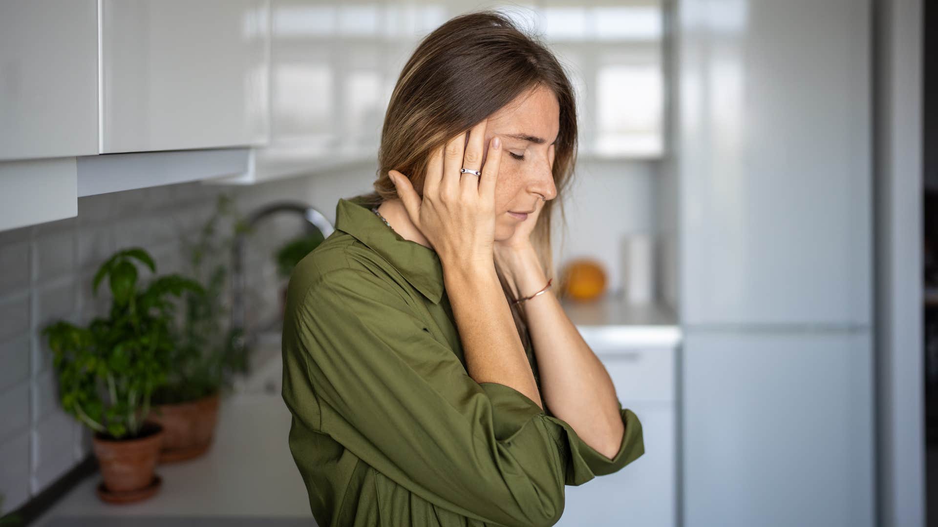 exhausted woman touching her head