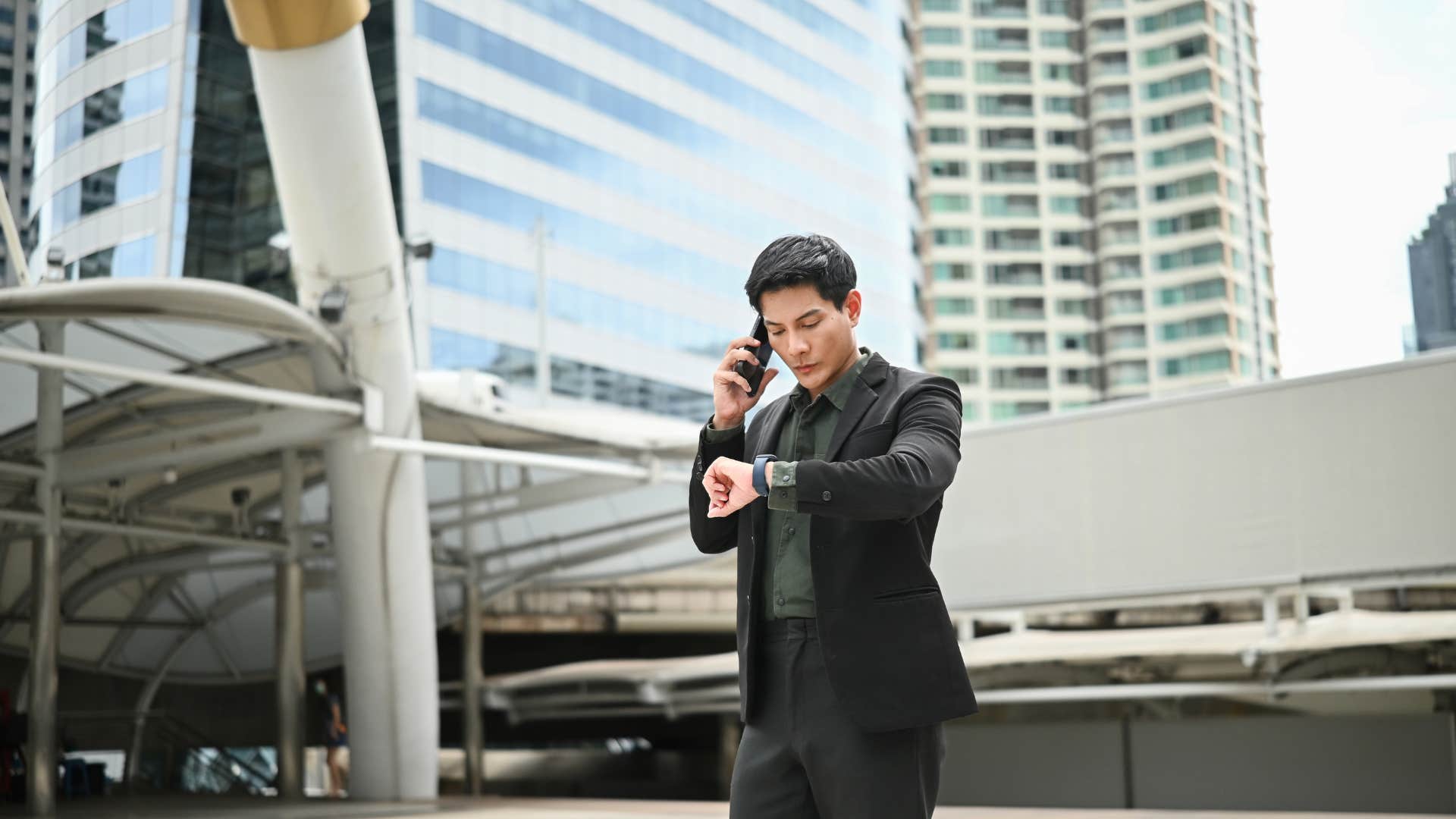 man checking watch running late