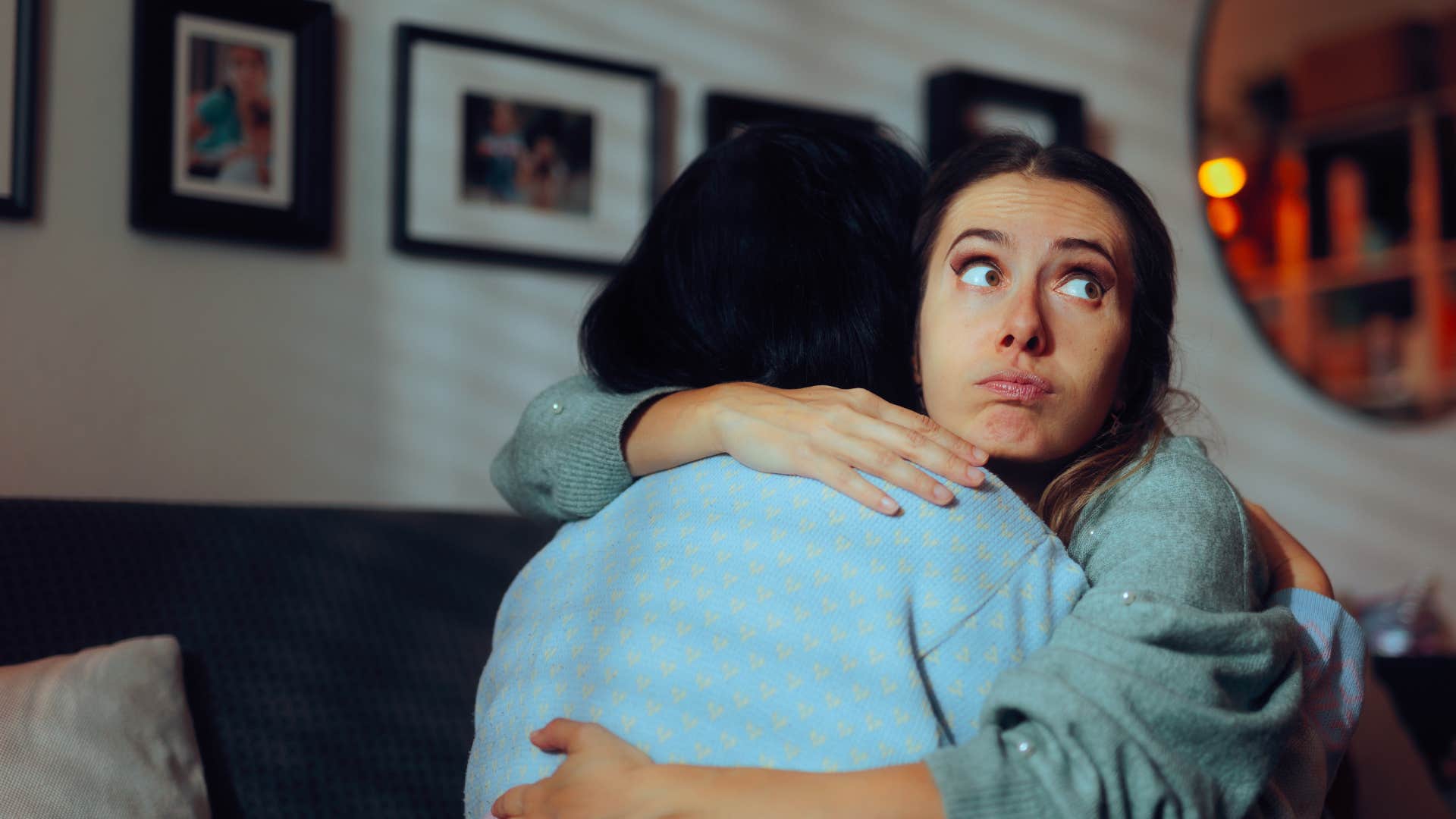 woman hugging friend as she thinks i really think we should just move on