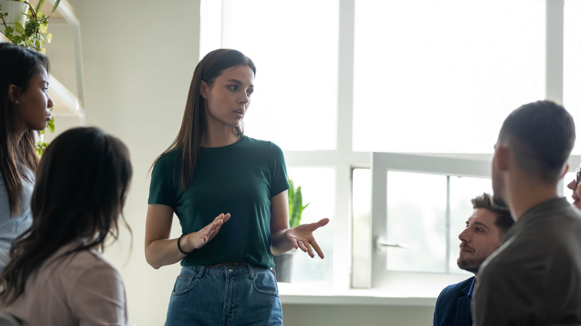 woman in green shirt telling man i really think you should calm down