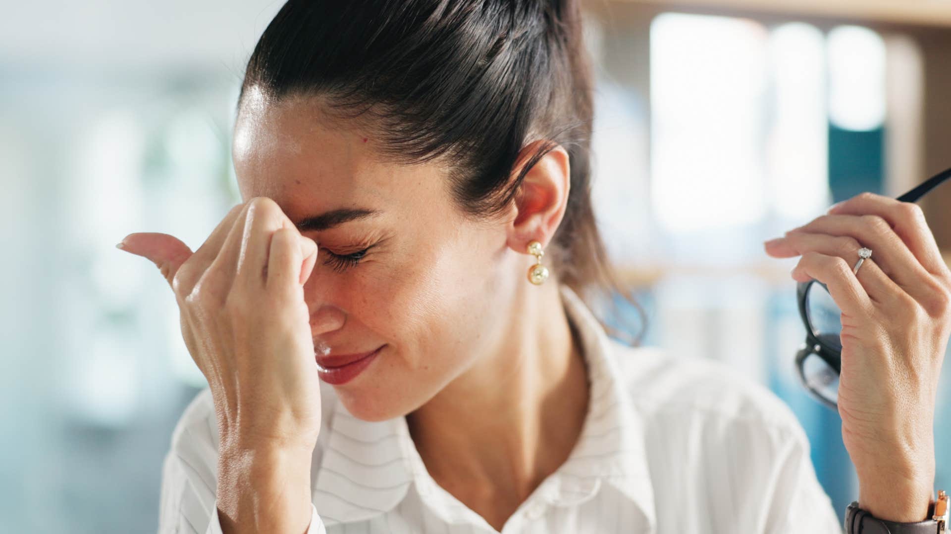 woman dealing with headache in pain
