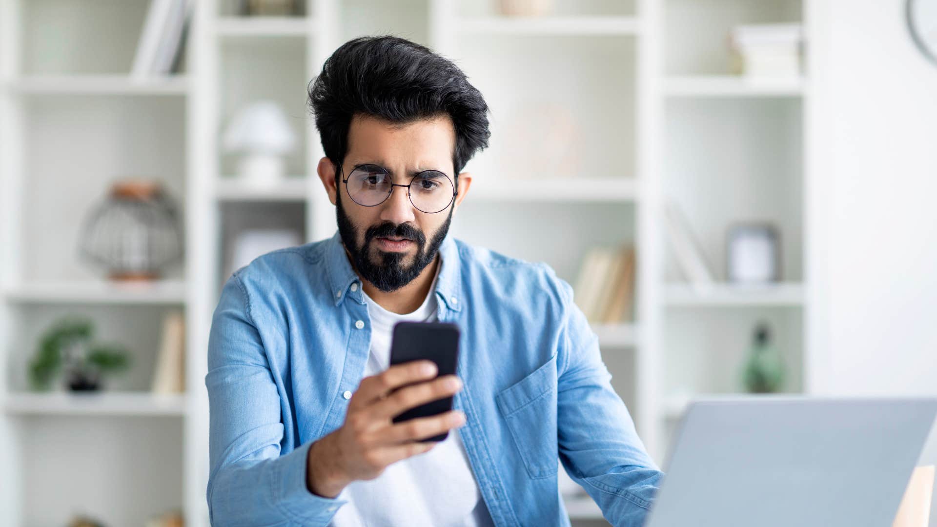 man on his phone at work