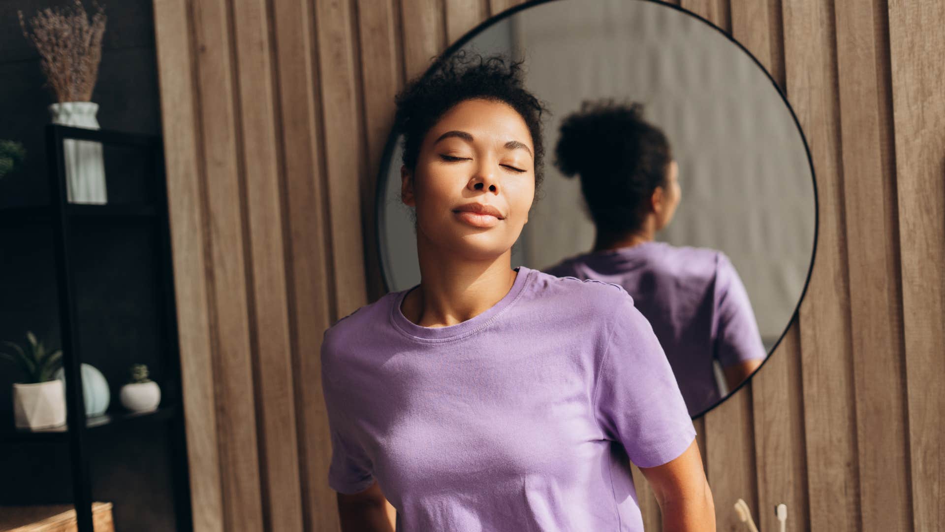 woman taking a moment of peace in the bathroom