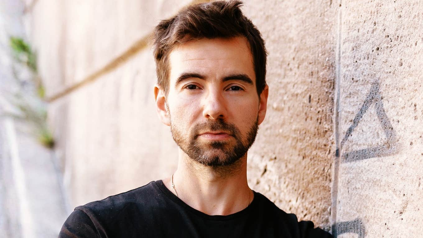 calm expressionless person giving an unreadable stare, capturing the subtle tells that expose people with sociopathic traits even when they blend in perfectly